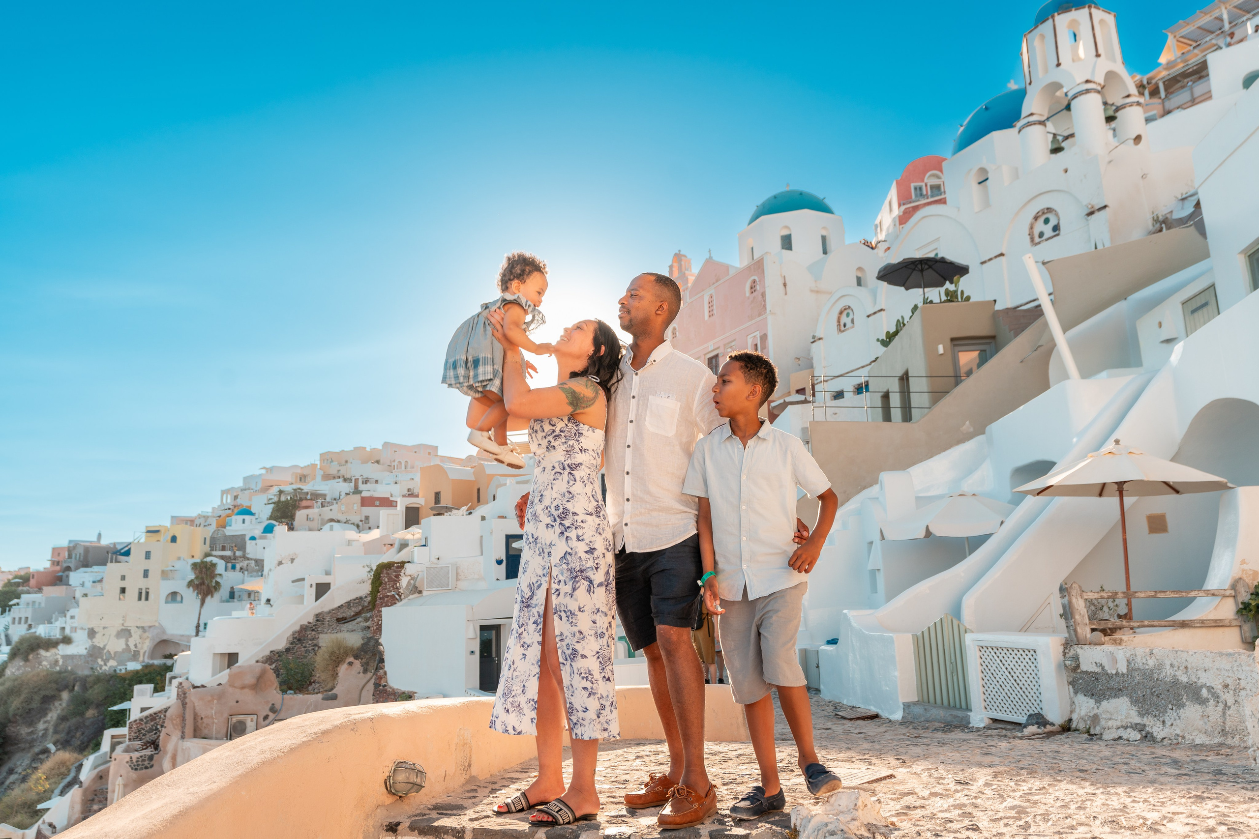 "Book a professional family photographer in Santorini and capture your love in the most beautiful setting. Perfect for vacations, anniversaries, or special milestones."