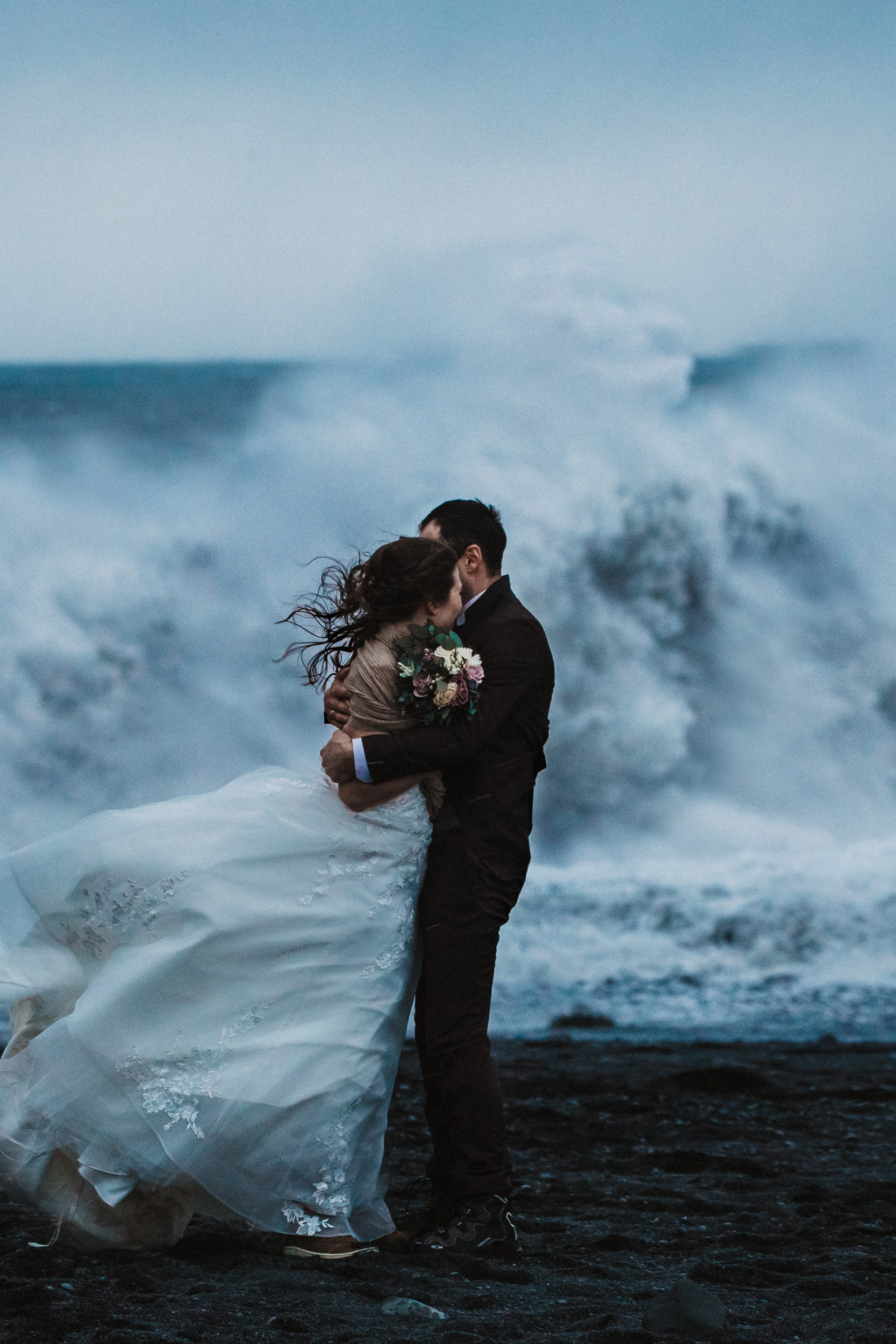 Winter elopement in Iceland | Stormy elopement at Black sand beach