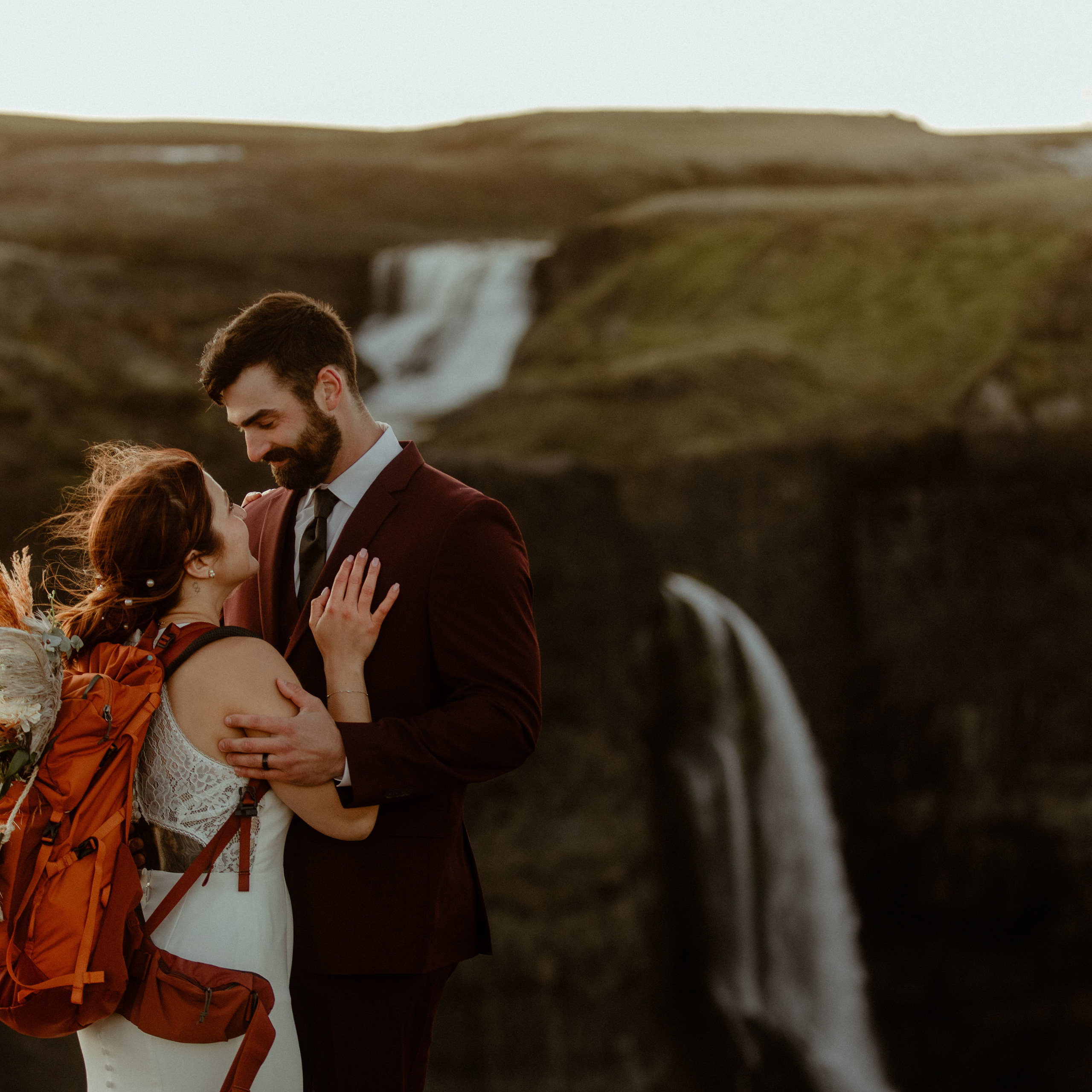 Couple hiking with backpack on their elopement in Iceland