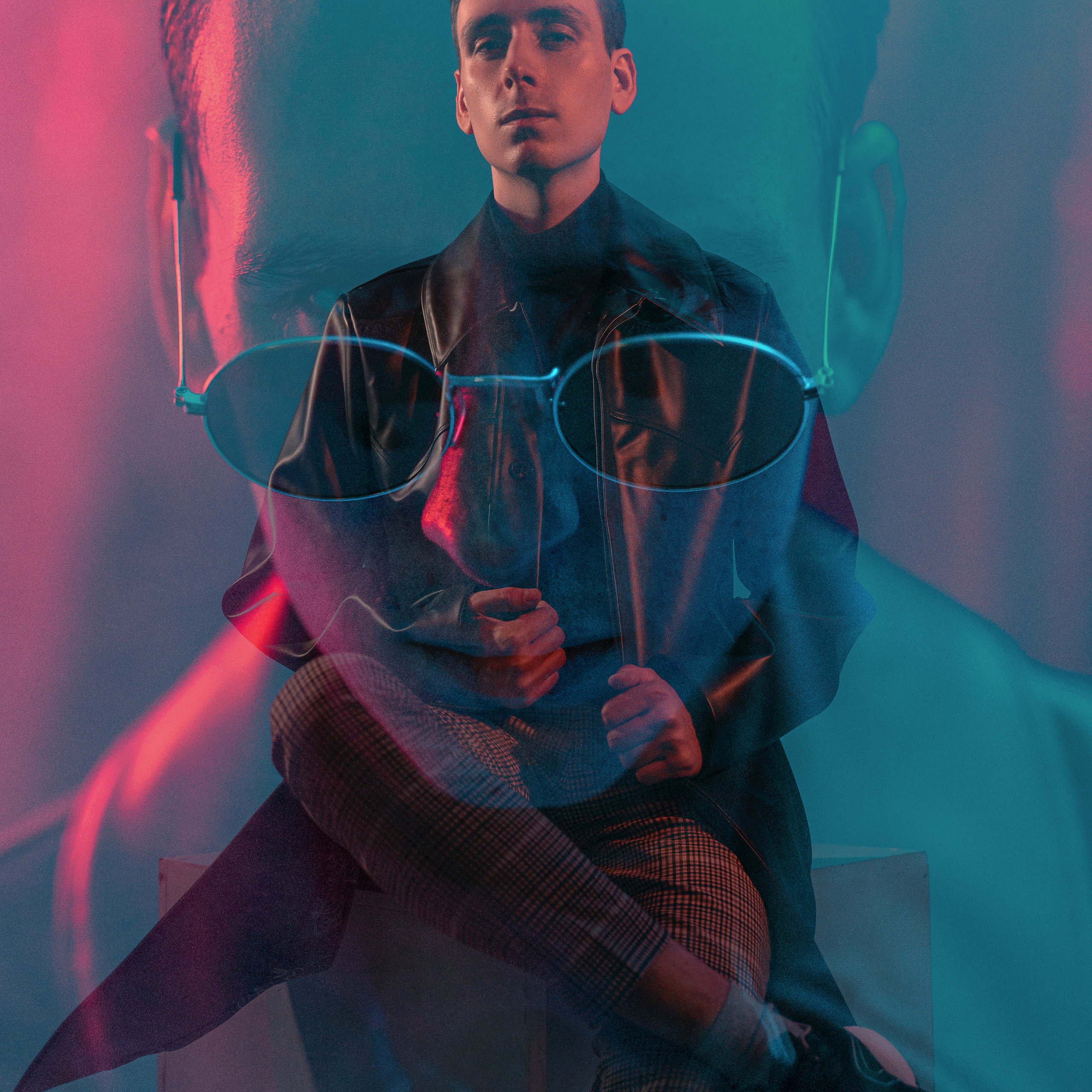 Man in a double exposure effect with transparent glasses