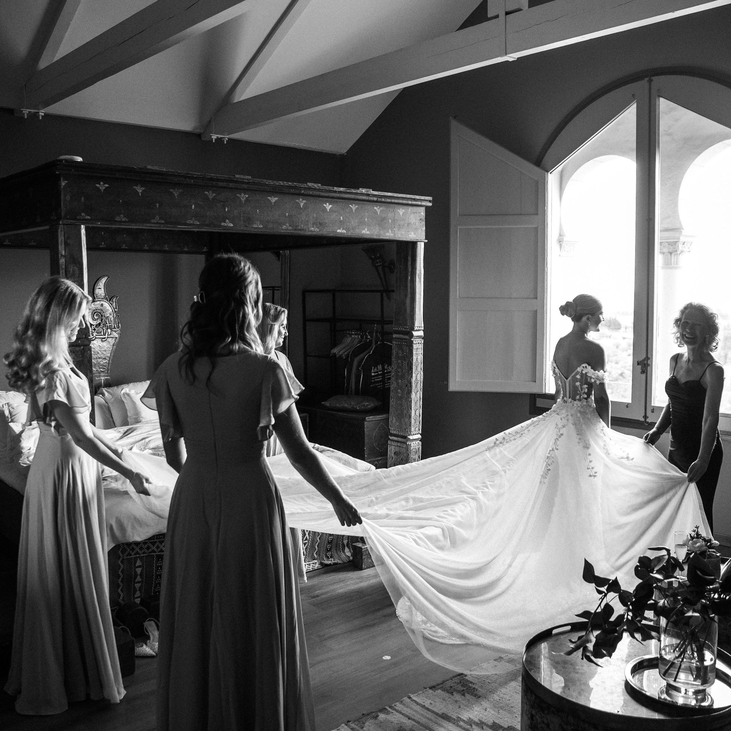 Getting ready a moment before the bride goes down the aisle of her destination wedding in Spain