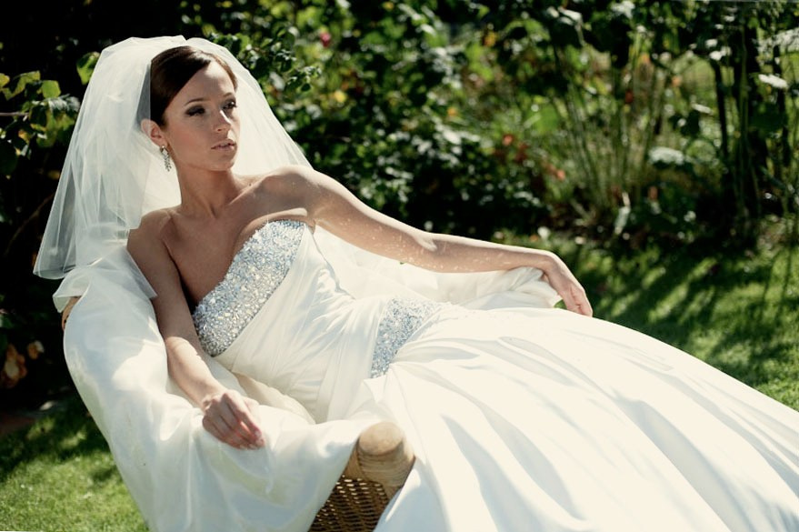 Best Female Wedding photographer in Amsterdam and Brussels, bride on a green field with a dress with diamonds