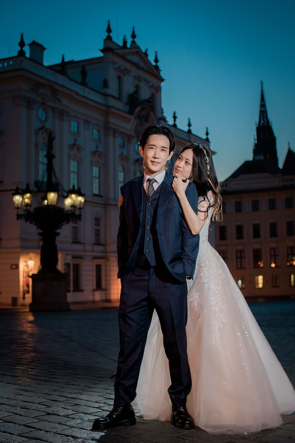 Korean couple night time pre-wedding at the historic Prague Castle, pictured near the Bishop's Palace.