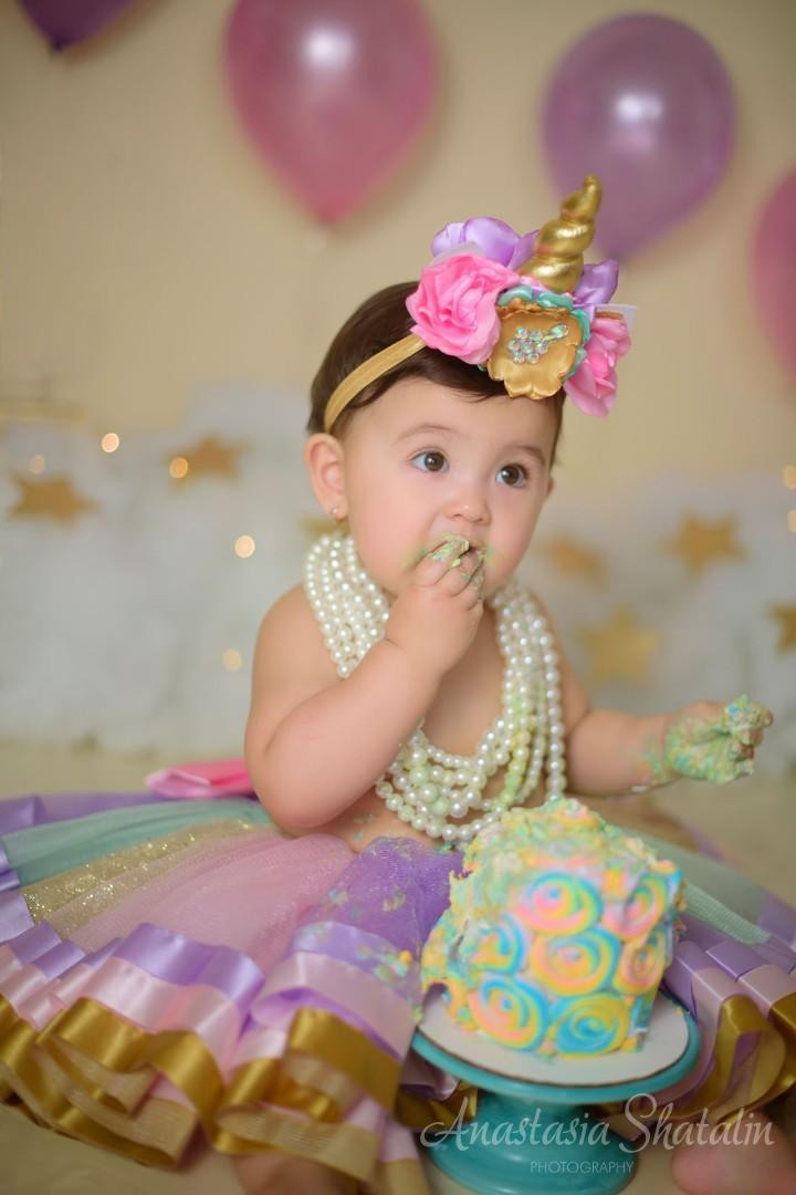 Unicorn cake smash session for Mia. Family photographer in Roseville, Rocklin, Folsom, Sacramento