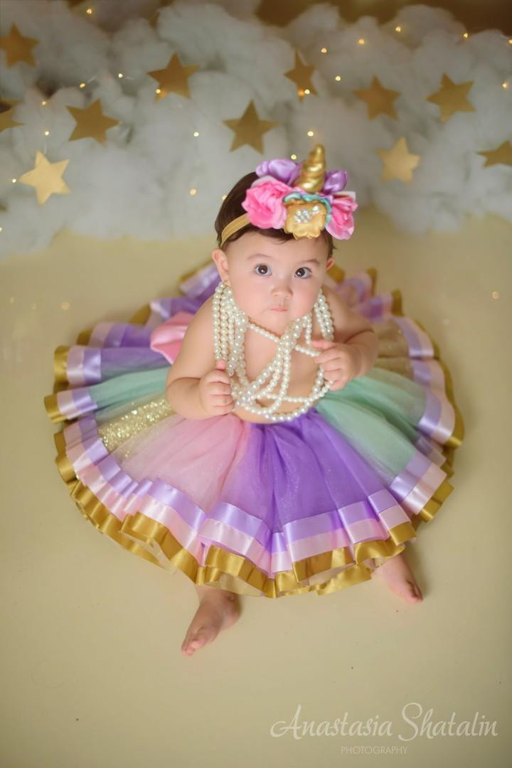 Unicorn cake smash session for Mia. Family photographer in Roseville, Rocklin, Folsom, Sacramento