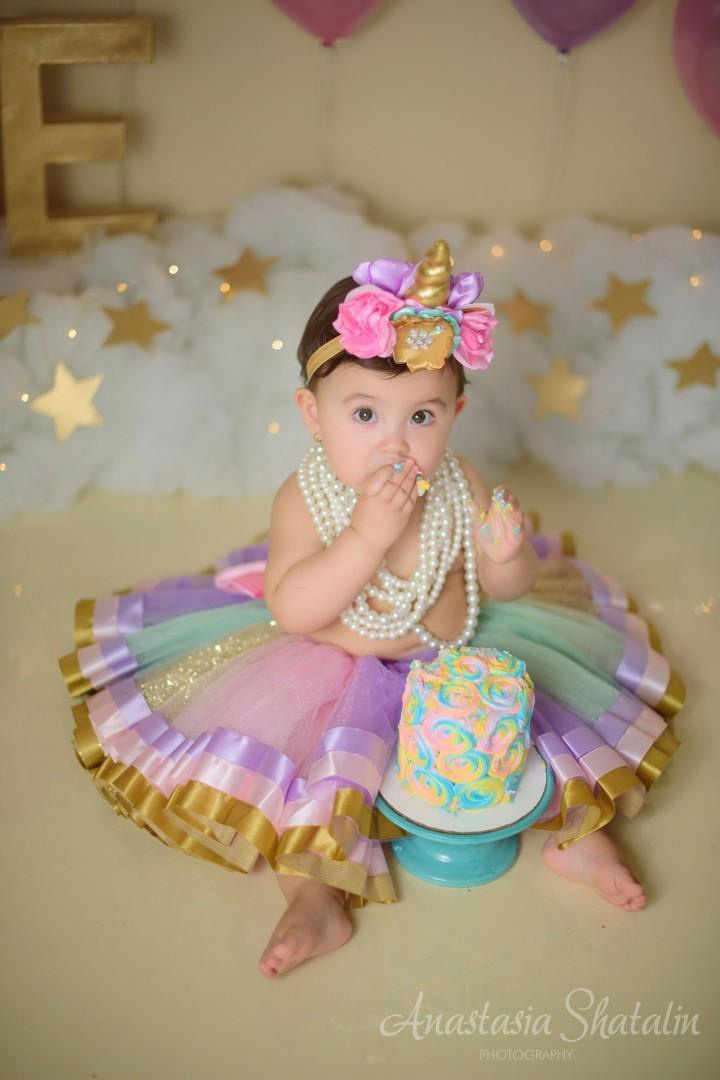 Unicorn cake smash session for Mia. Family photographer in Roseville, Rocklin, Folsom, Sacramento
