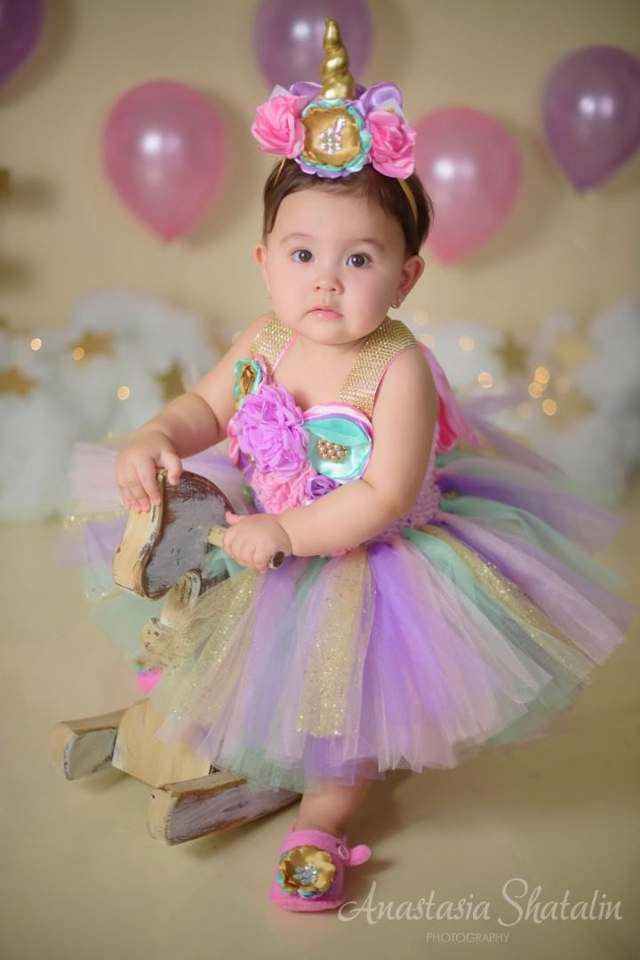 Unicorn cake smash session for Mia. Family photographer in Roseville, Rocklin, Folsom, Sacramento