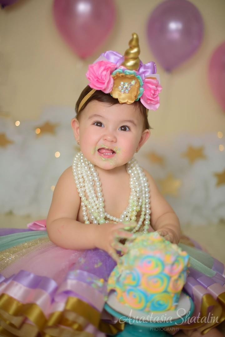 Unicorn cake smash session for Mia. Family photographer in Roseville, Rocklin, Folsom, Sacramento