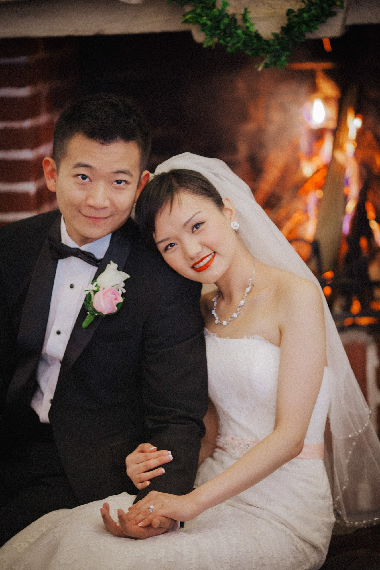 A fireplace decorated with Christmas motifs provides the needed warmth for the Hong Kong newlyweds after their castle wedding and portrait session.