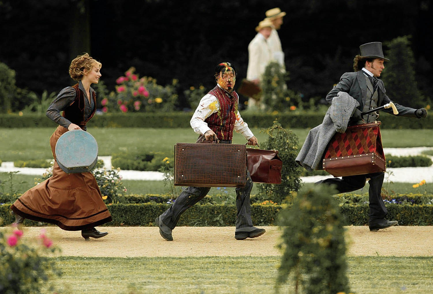 Cecile de France, Jackie Chan, and Steve Coogan run through a scene on the set of 'Around the World in 80 Days' while filming outside of Berlin.