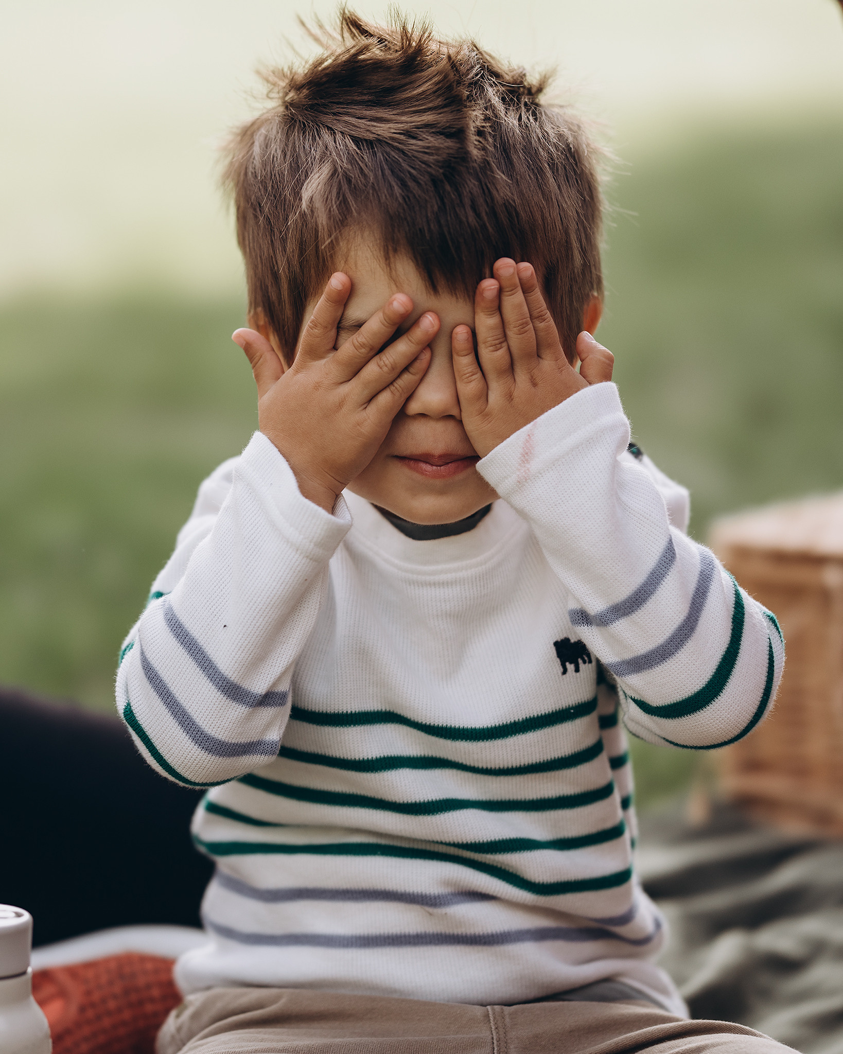 toddler plays peek a boo