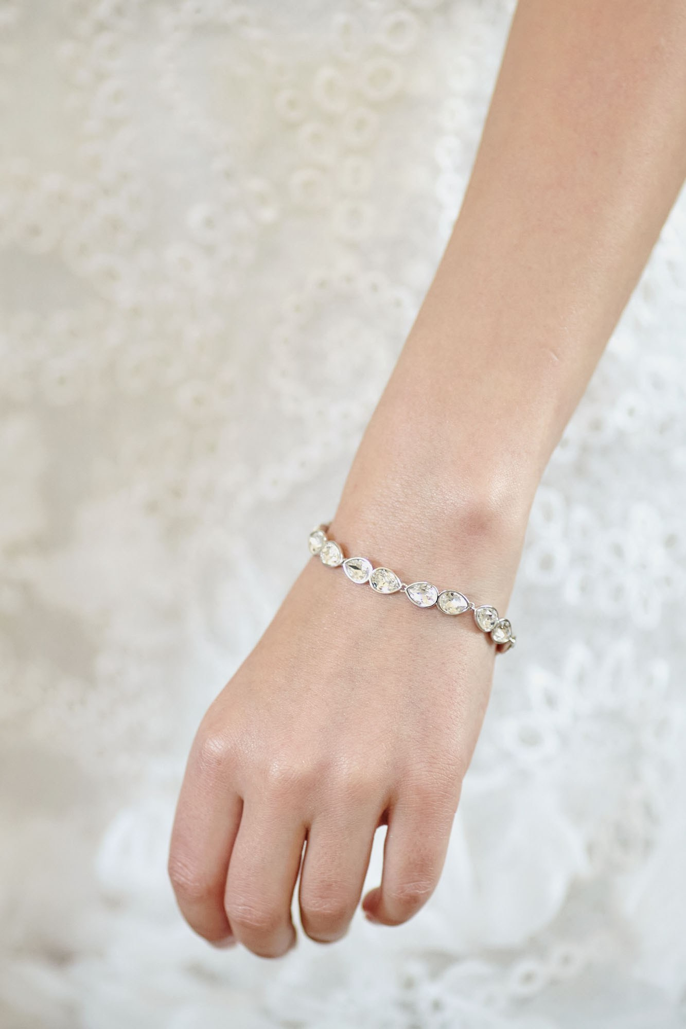 A close up view of the diamond bracelet the bride chose for her wedding day.