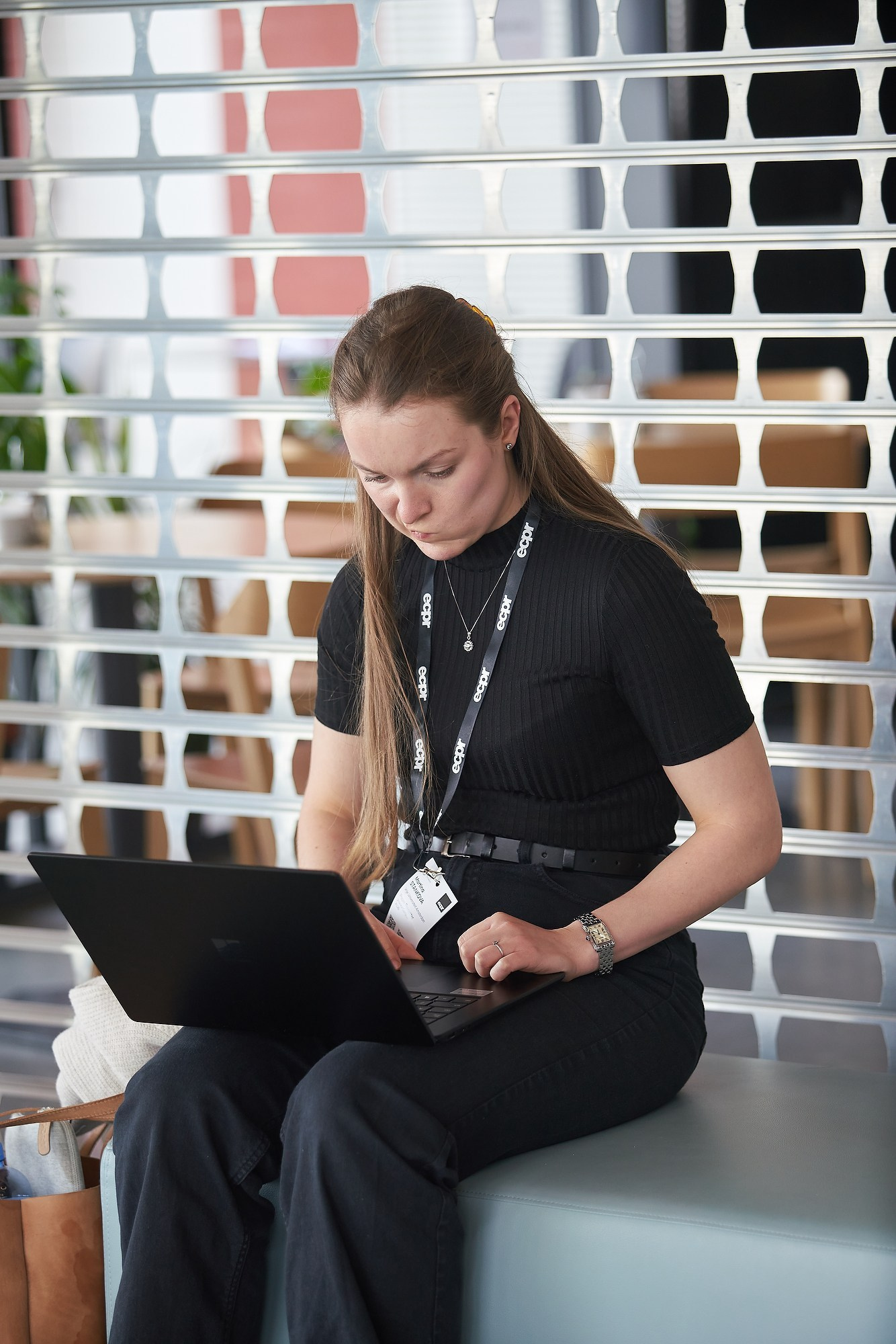 A young researcher takes note on her laptop following an ECPR workshop.