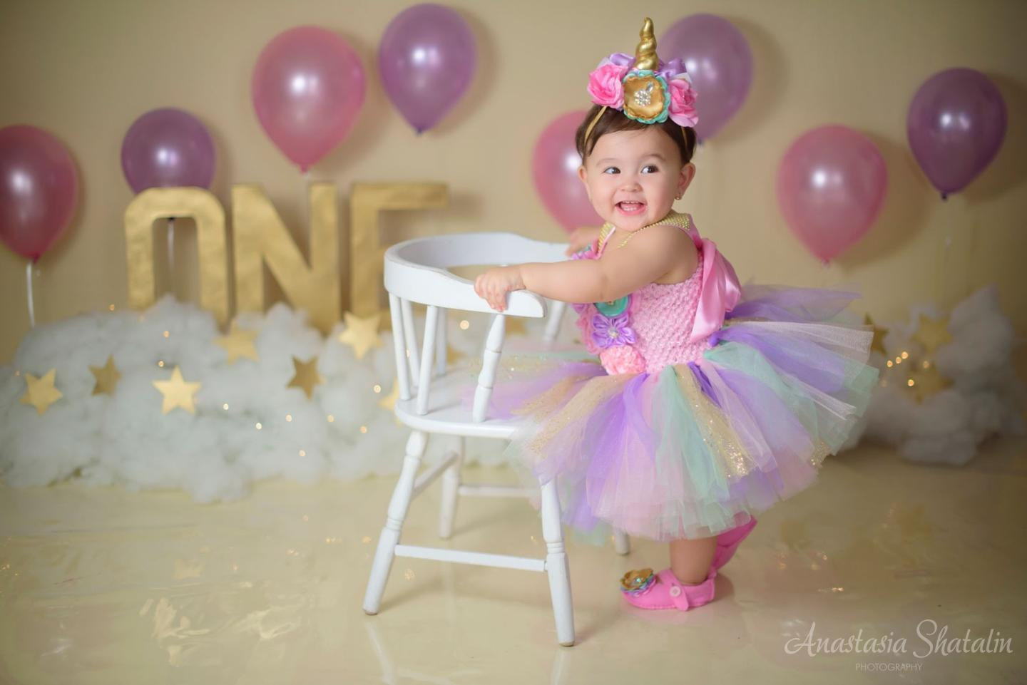 Unicorn cake smash session for Mia. Family photographer in Roseville, Rocklin, Folsom, Sacramento