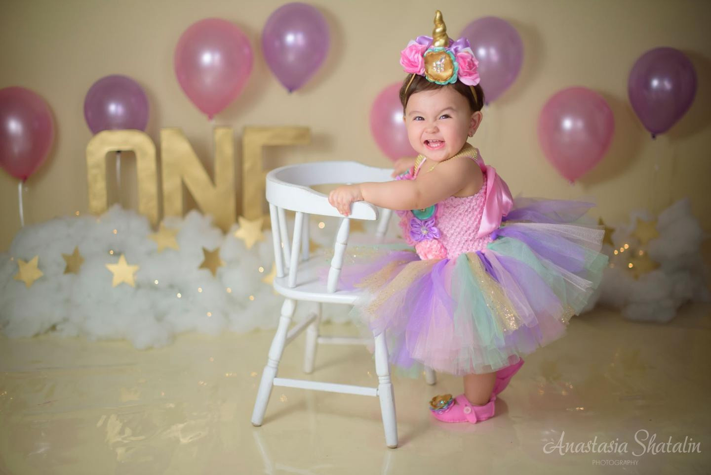 Unicorn cake smash session for Mia. Family photographer in Roseville, Rocklin, Folsom, Sacramento