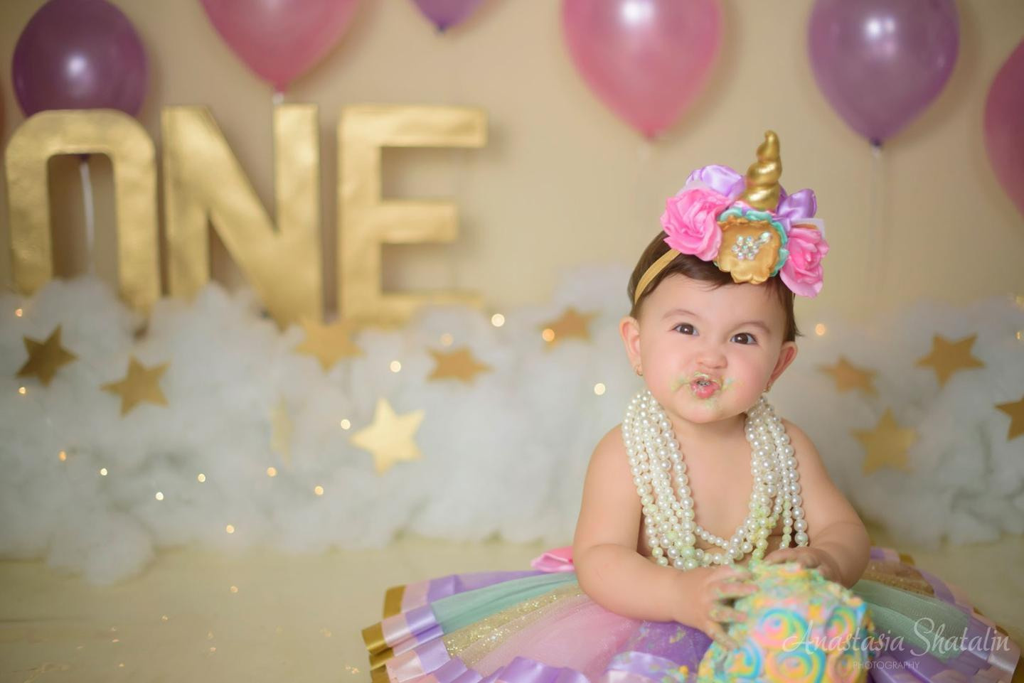 Unicorn cake smash session for Mia. Family photographer in Roseville, Rocklin, Folsom, Sacramento