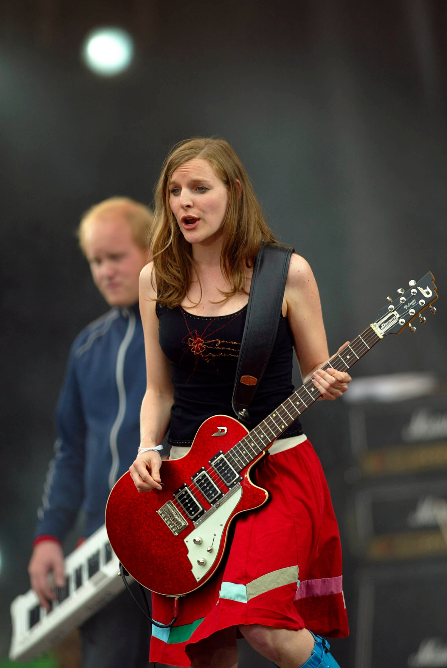 Judith Holofernes of Wir sind Helden belts out anthemic German pop-rock to an ecstatic audience.