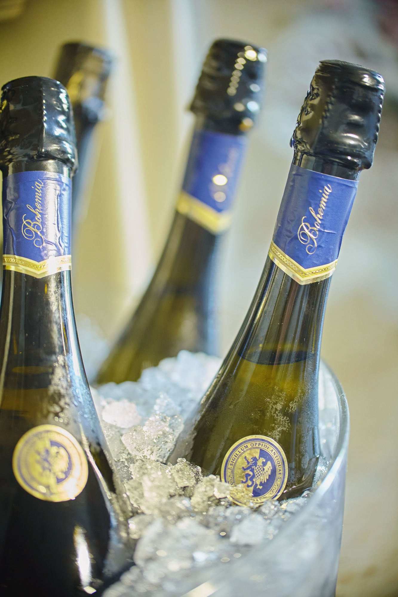 Ice bucket holding four bottles of Bohemia Sekt Champagne, perfect for celebrations.