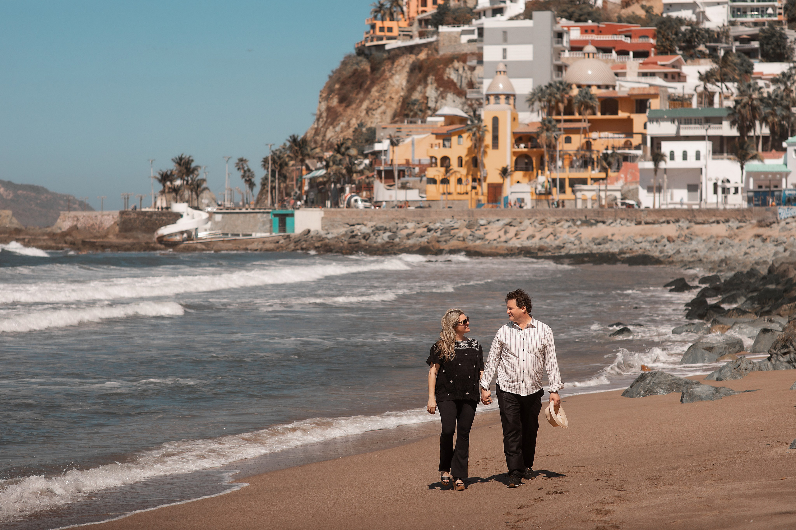 Golden sunset over Mazatlán's Playa Olas Altas — iconic Malecón boardwalk perfect for romantic walks in Mexico's Pacific Coast