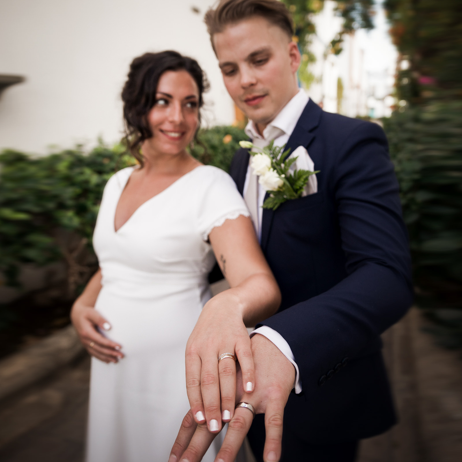 Love Story Photographer, Gran Canaria A bride and groom are posing for a wedding photo.