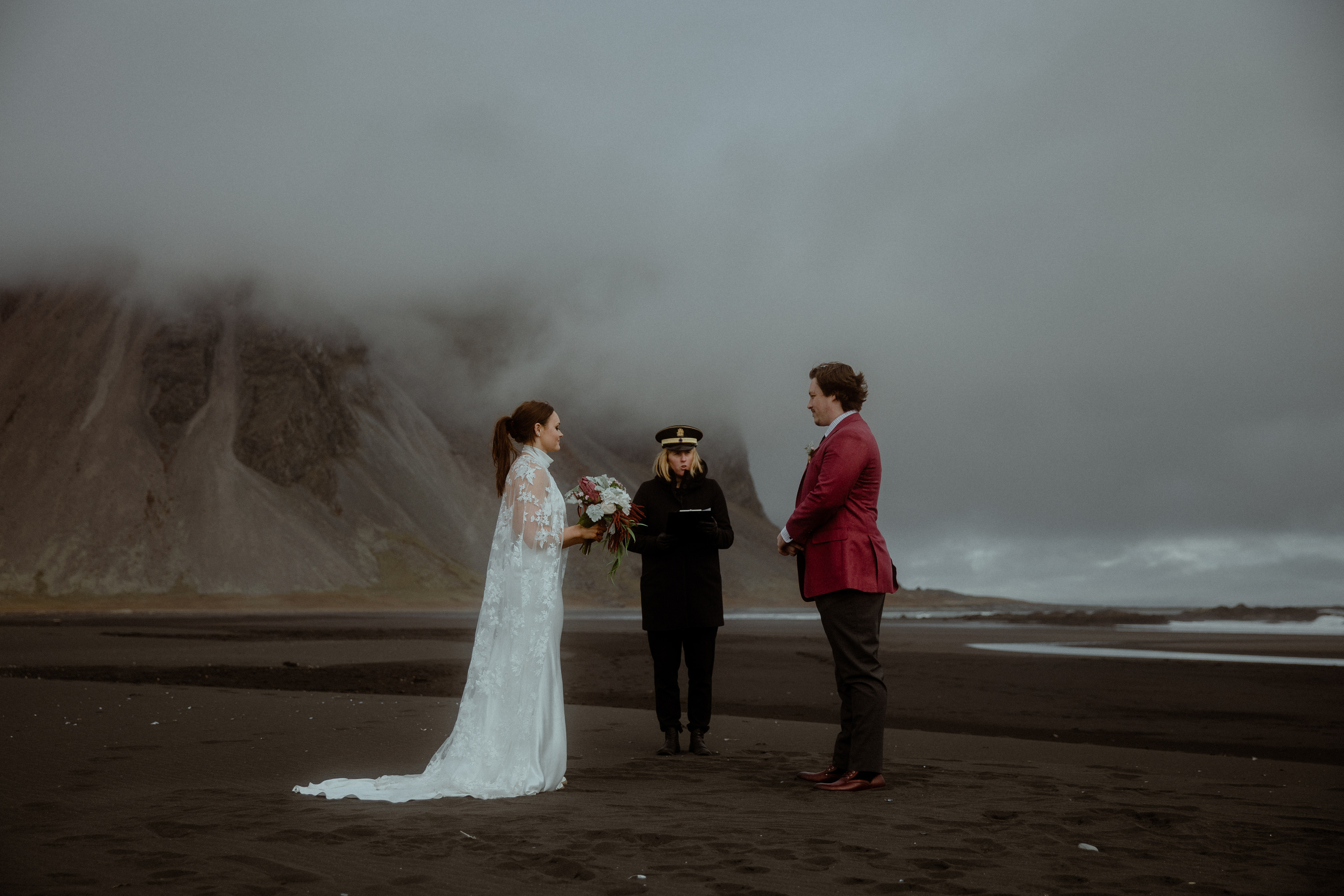Signing marriage certificate on a black sand beach in Iceland