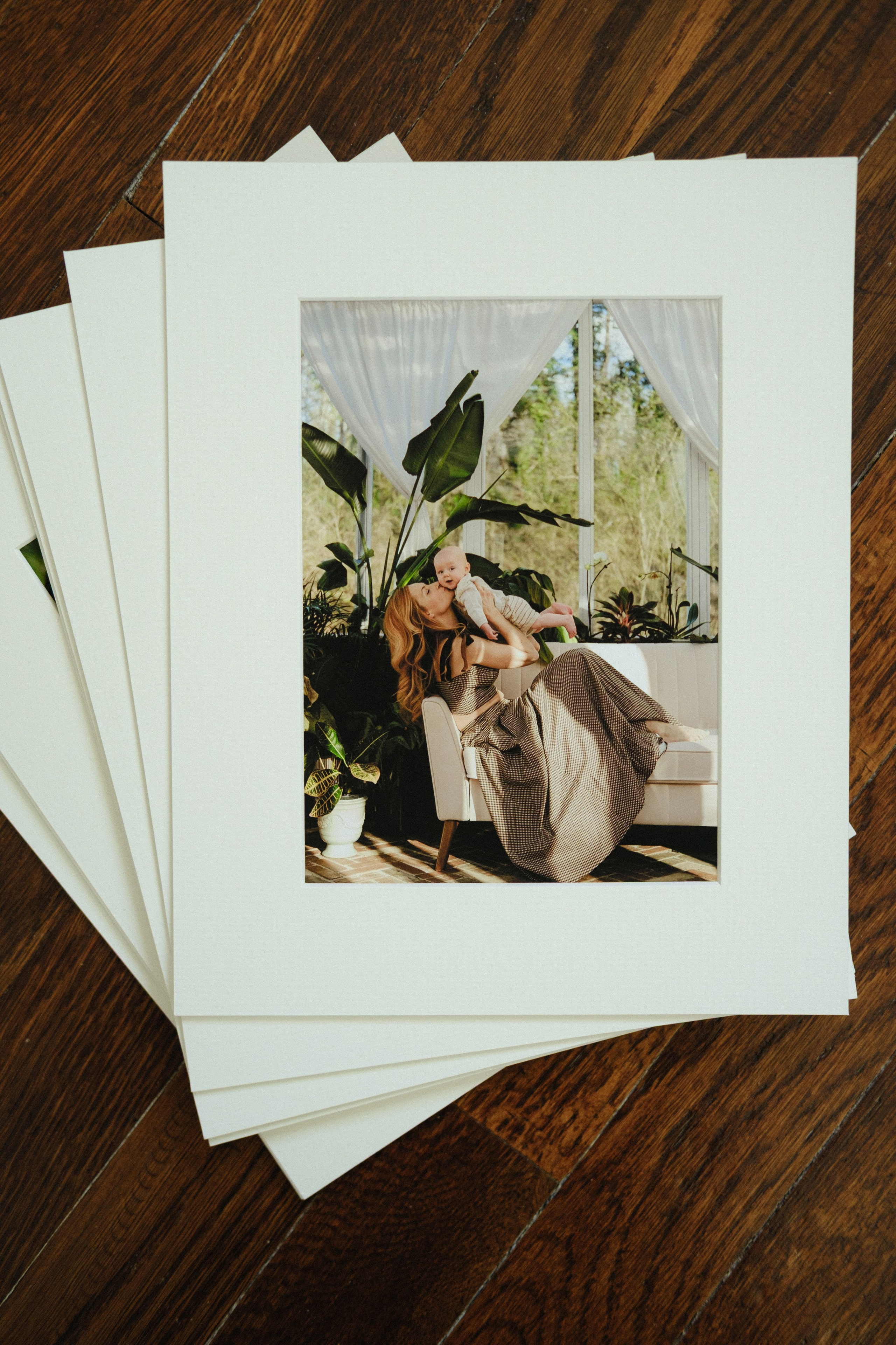 Fine art family photo prints on archival paper, styled flat lay with natural light – Richmond family photographer heirloom print collection
