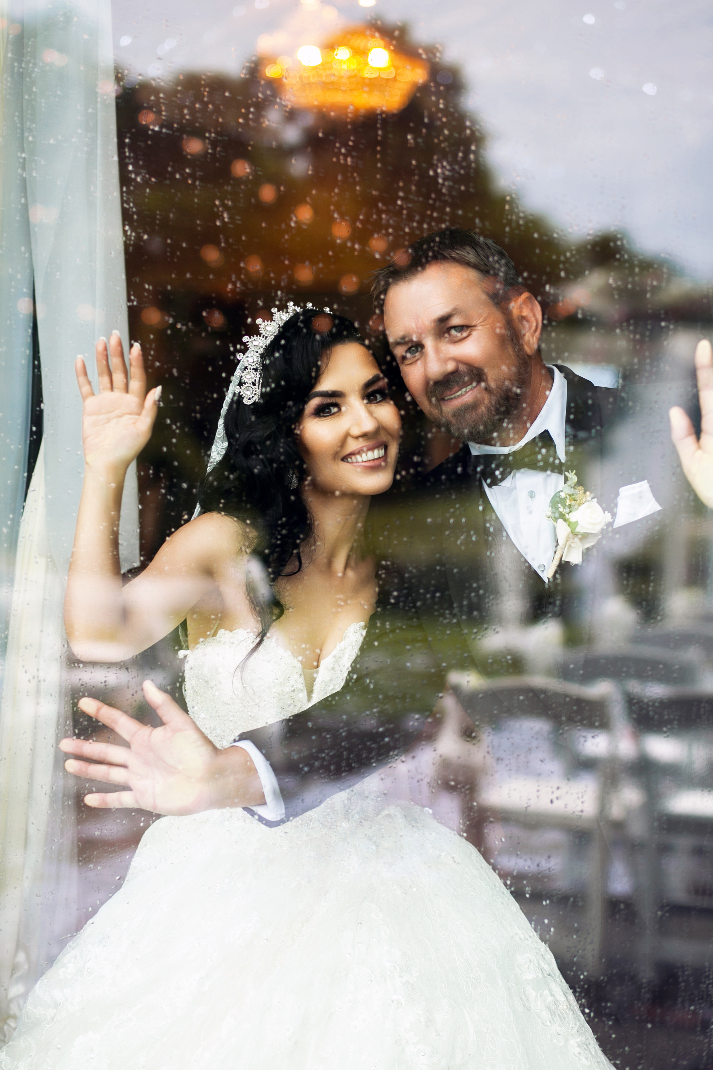 Bride & groom at the on the rainy day