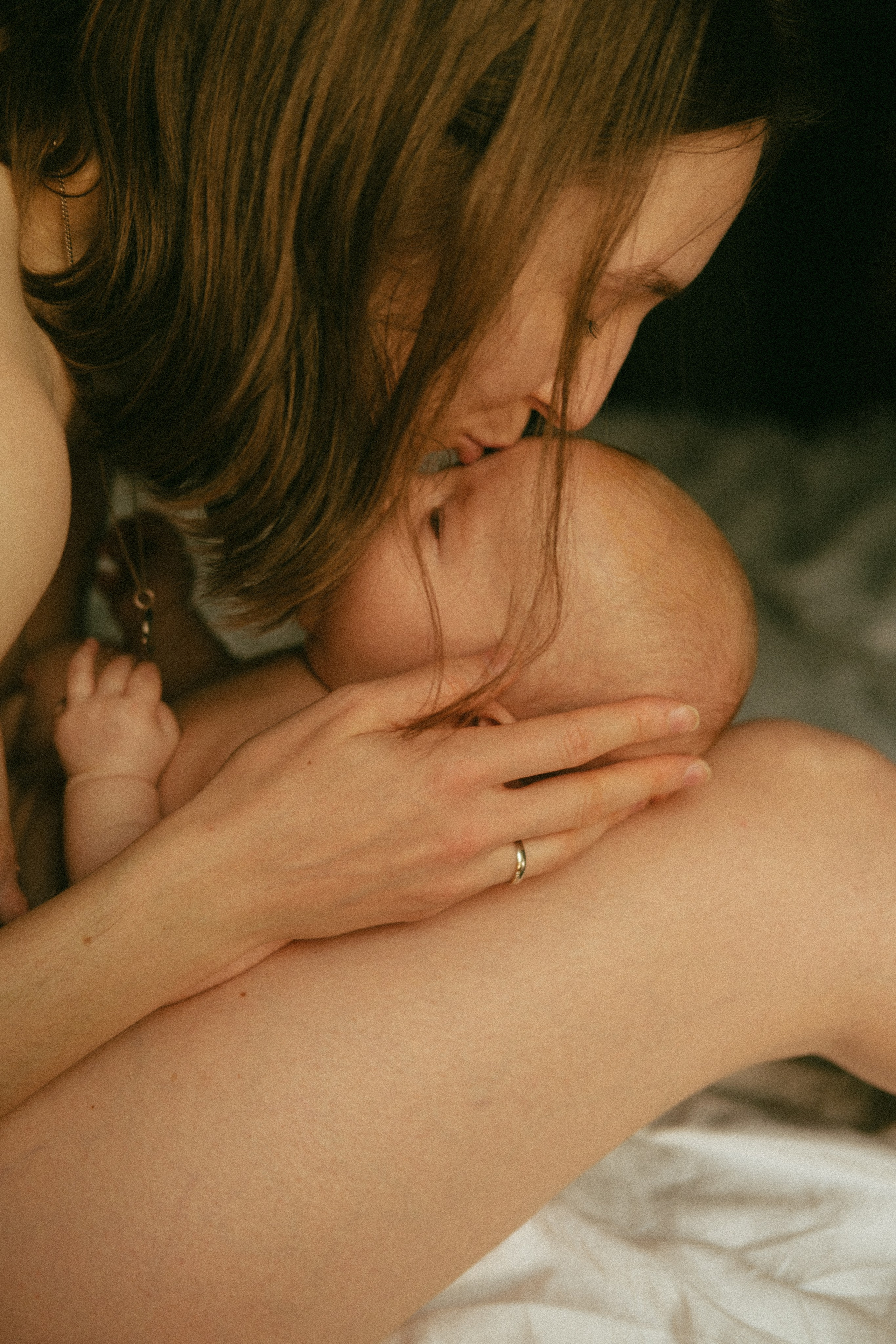 A joyful and authentic motherhood photograph that captures the unfiltered love and connection between mother and child.