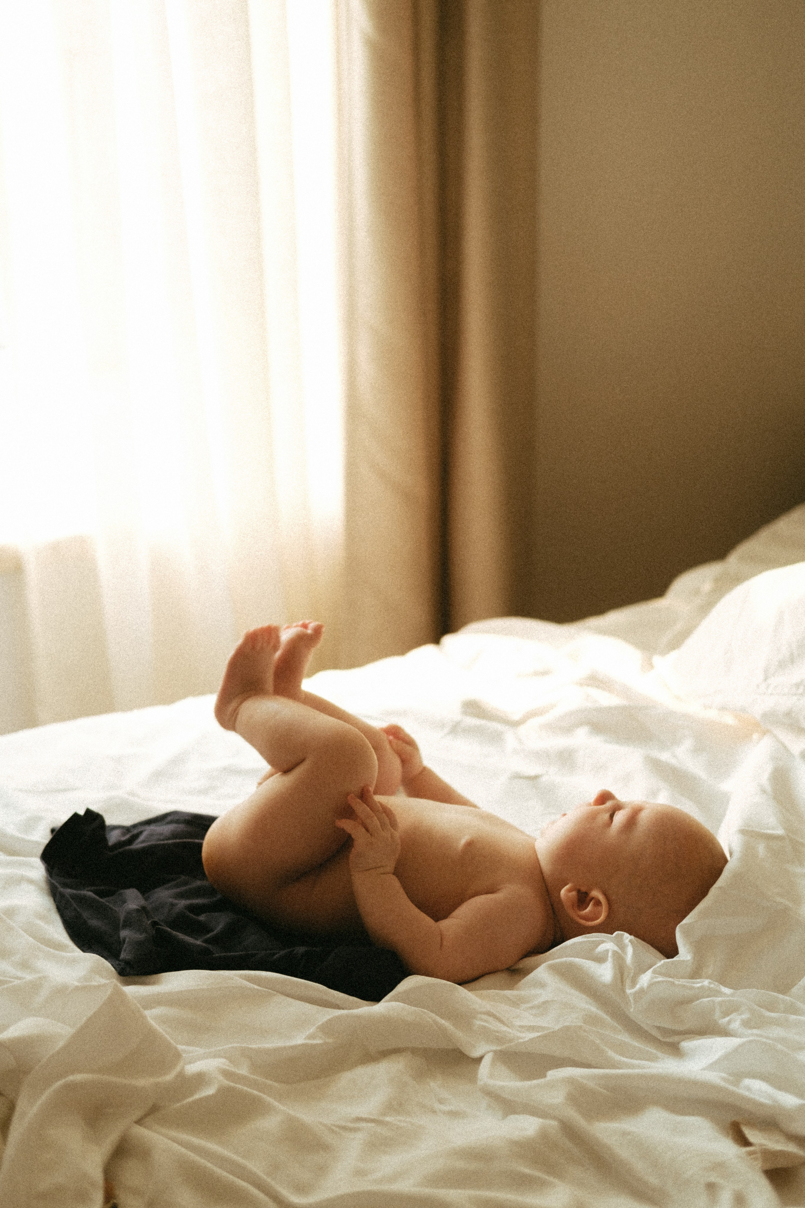A serene and heartfelt motherhood moment, showcasing the quiet beauty of an intimate motherhood photo session in natural light.