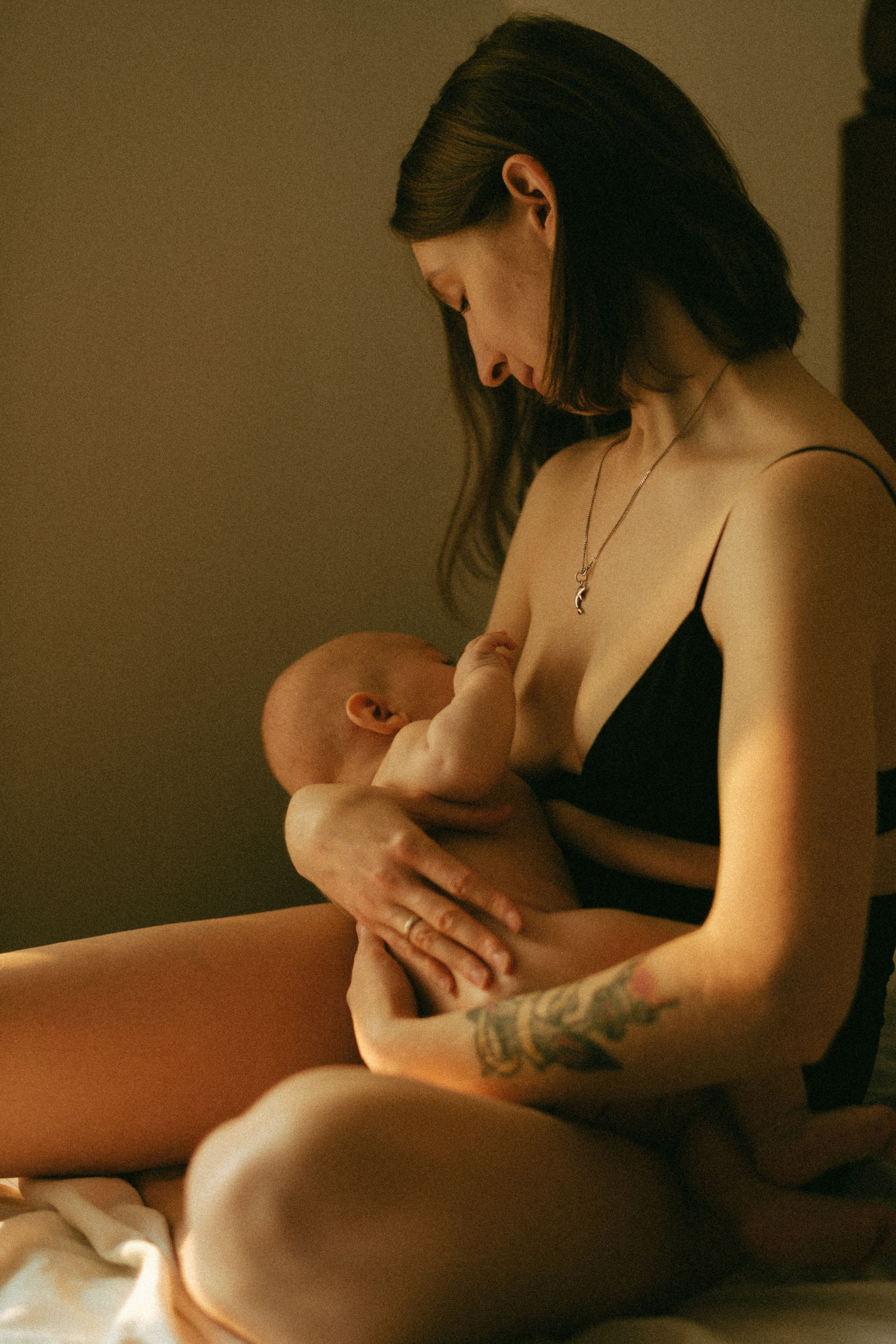 A natural and intimate motherhood scene, celebrating the quiet, unscripted moments that make motherhood so deeply meaningful.