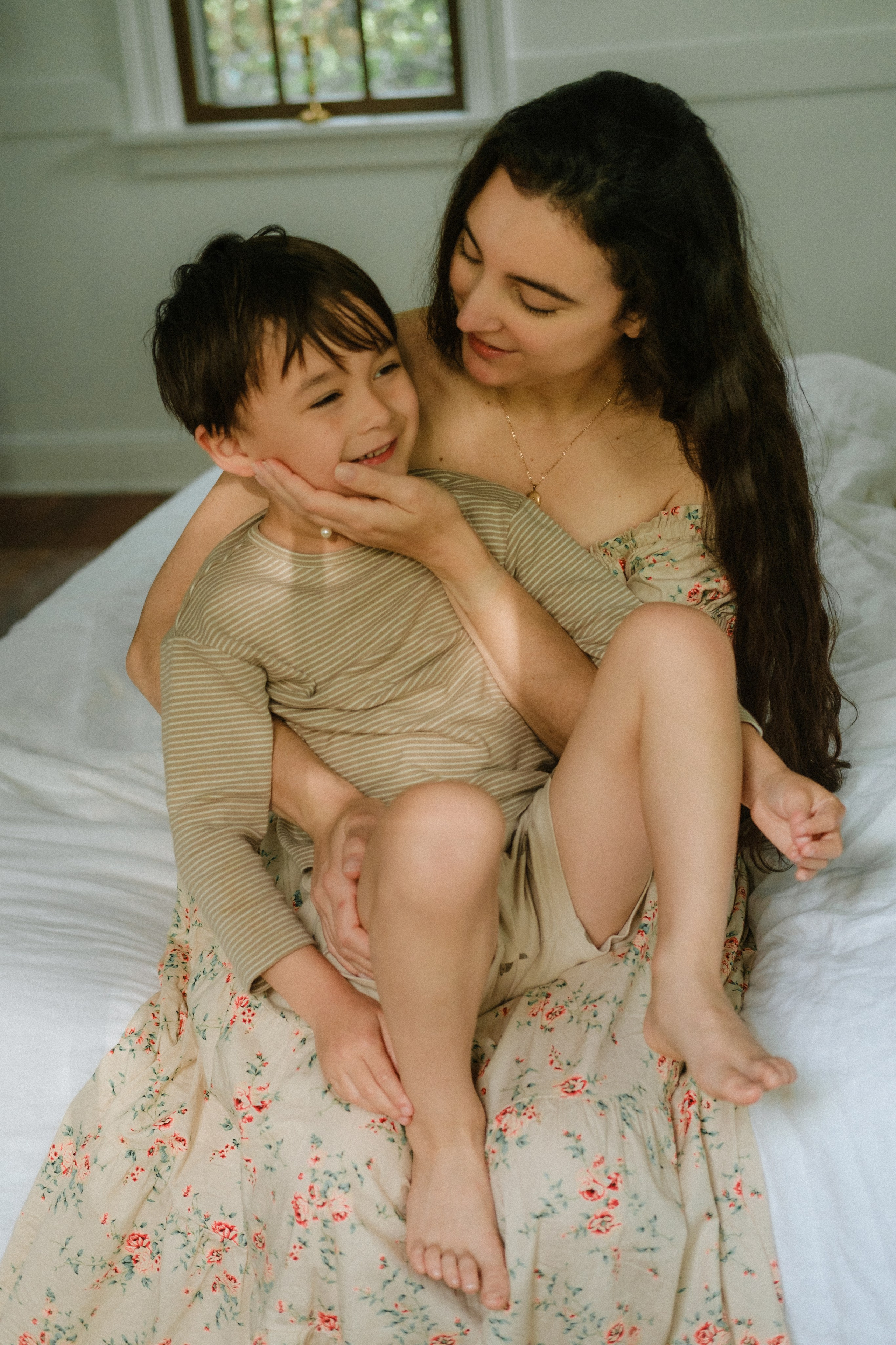 Young mom holding her baby in her arms in Richmond, VA