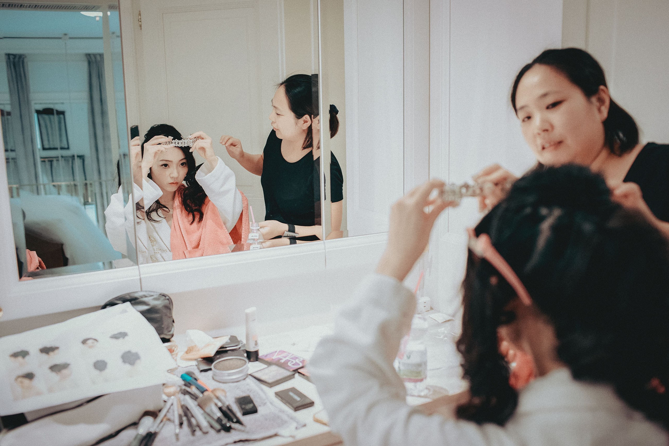 The happy bride-to-be as her makeup artist attends to her needs.