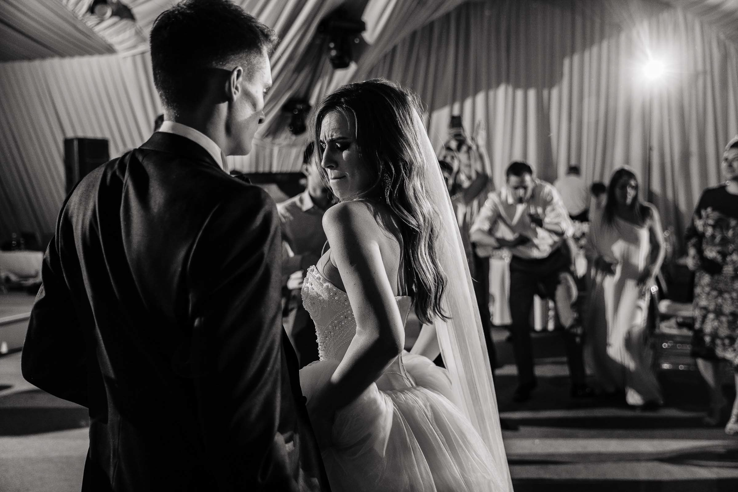 Bride and Groom dancing candid, by Tanya Bodgan, Bude, Cornwall wedding photography.