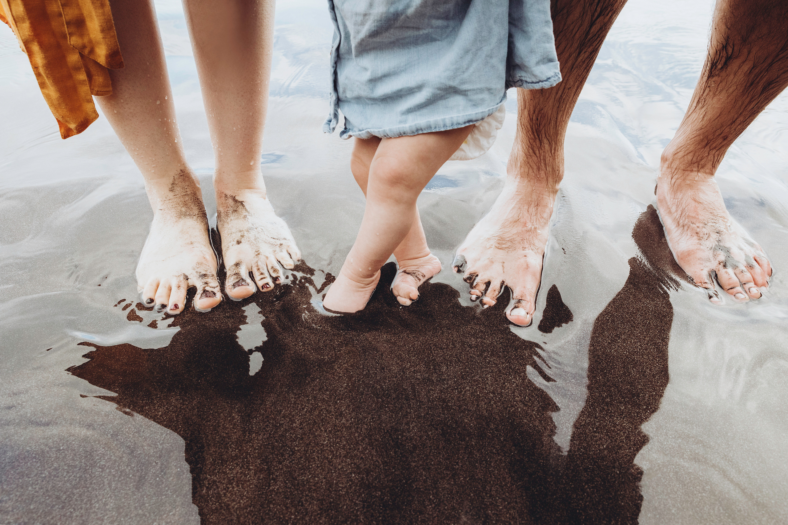 Family sitting near the beach at Tenerife.