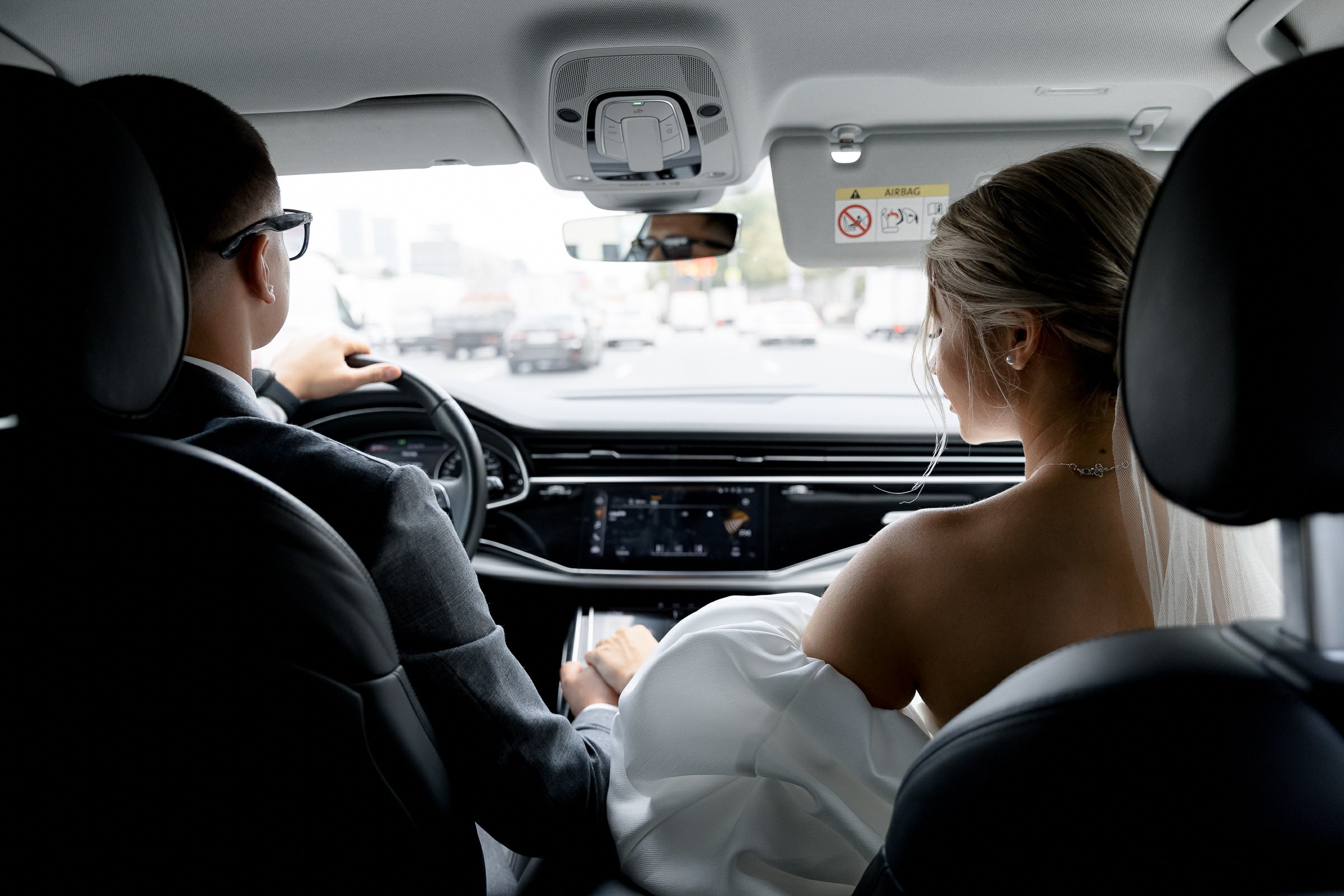 Bride and groom in car arriving at the ceremony, by Bude, Cornwall wedding photographer.