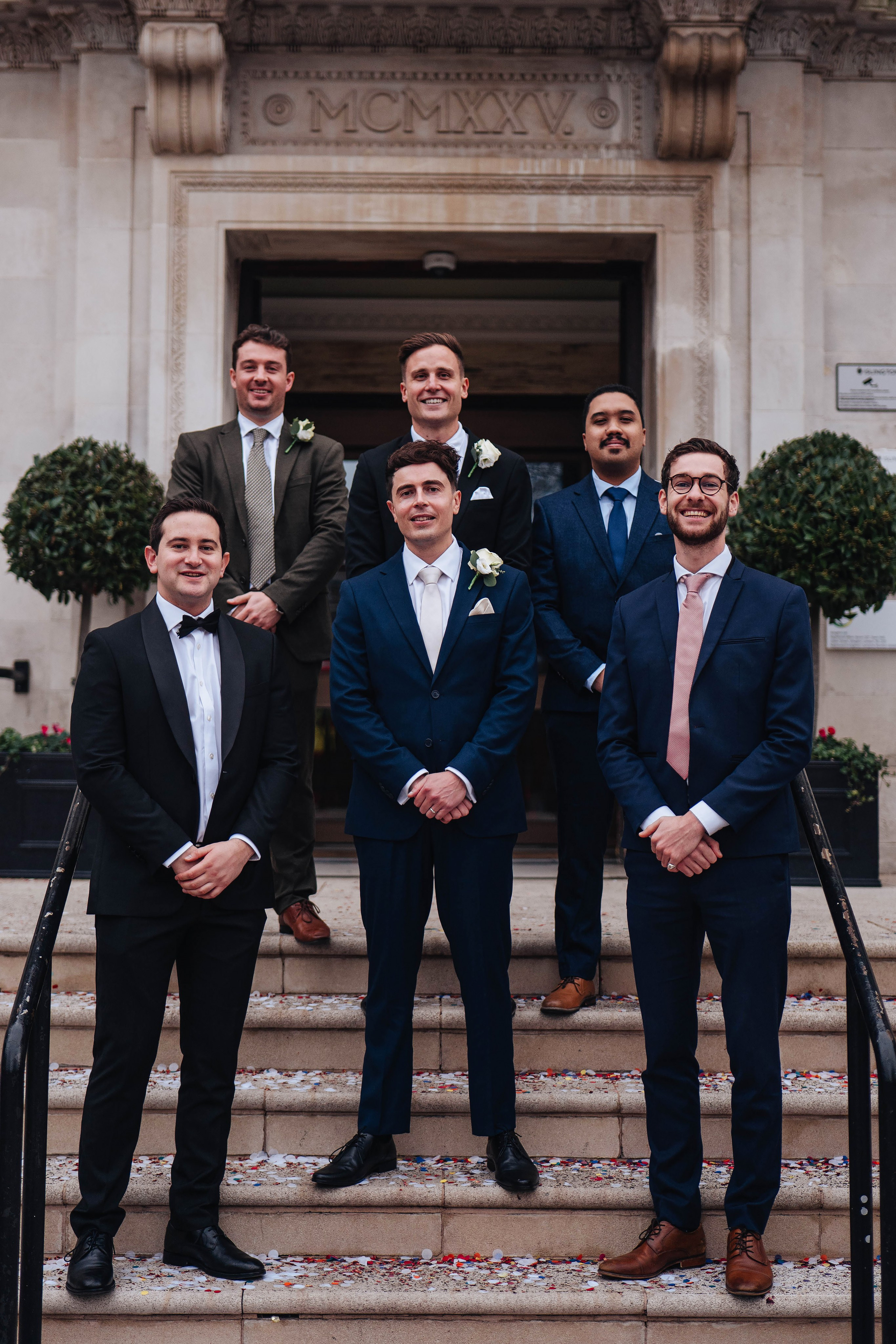 Exit from Islington town hall, meeting the couple with confetti, group photo