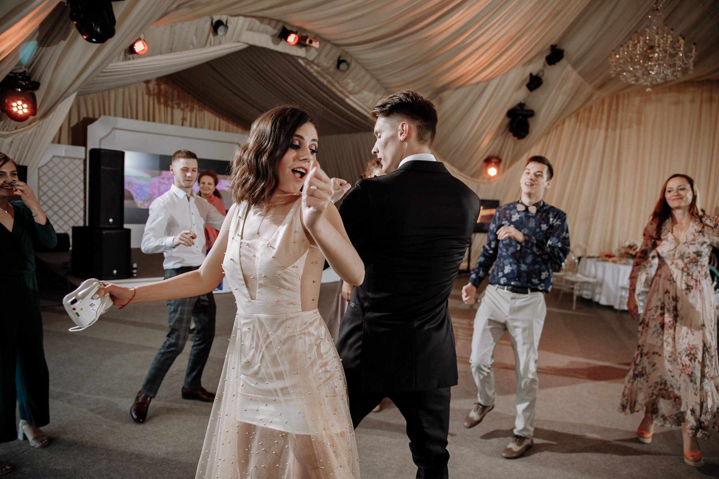 Dance floor with groom and guest, by Tanya Bodgan, Bude wedding photography.