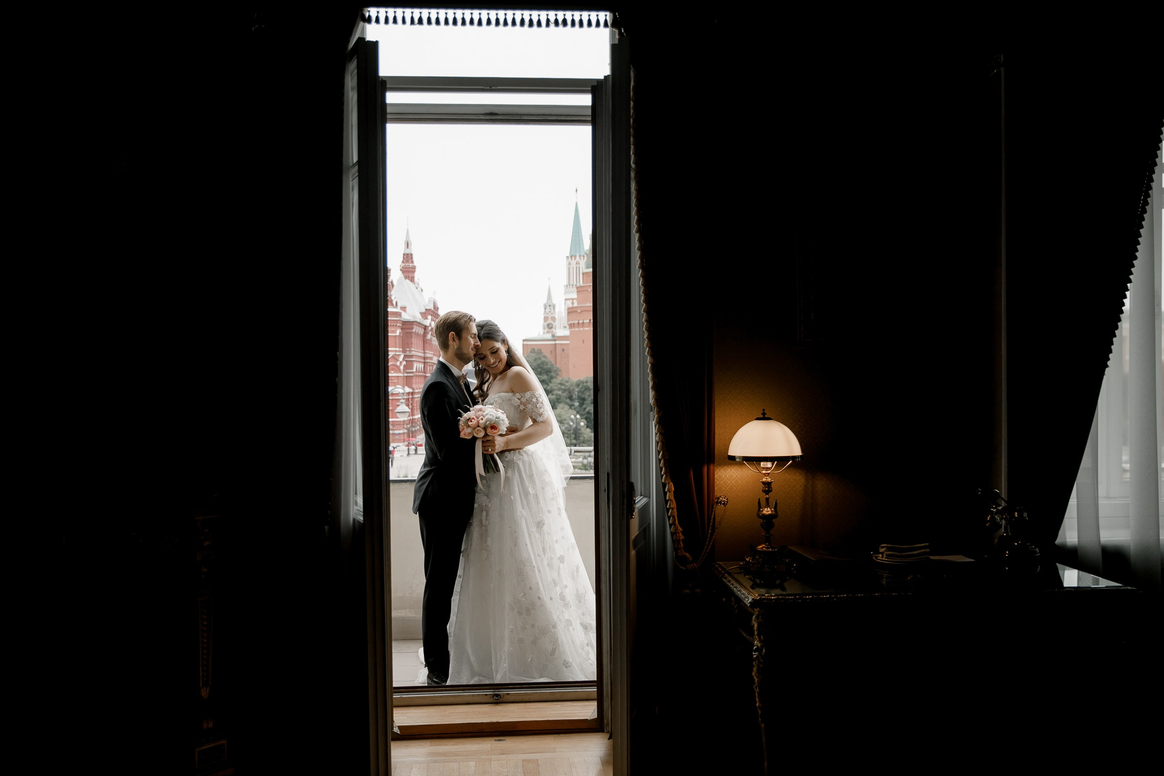 Couple’s quiet on moment balcony, by Bude, wedding photographer.