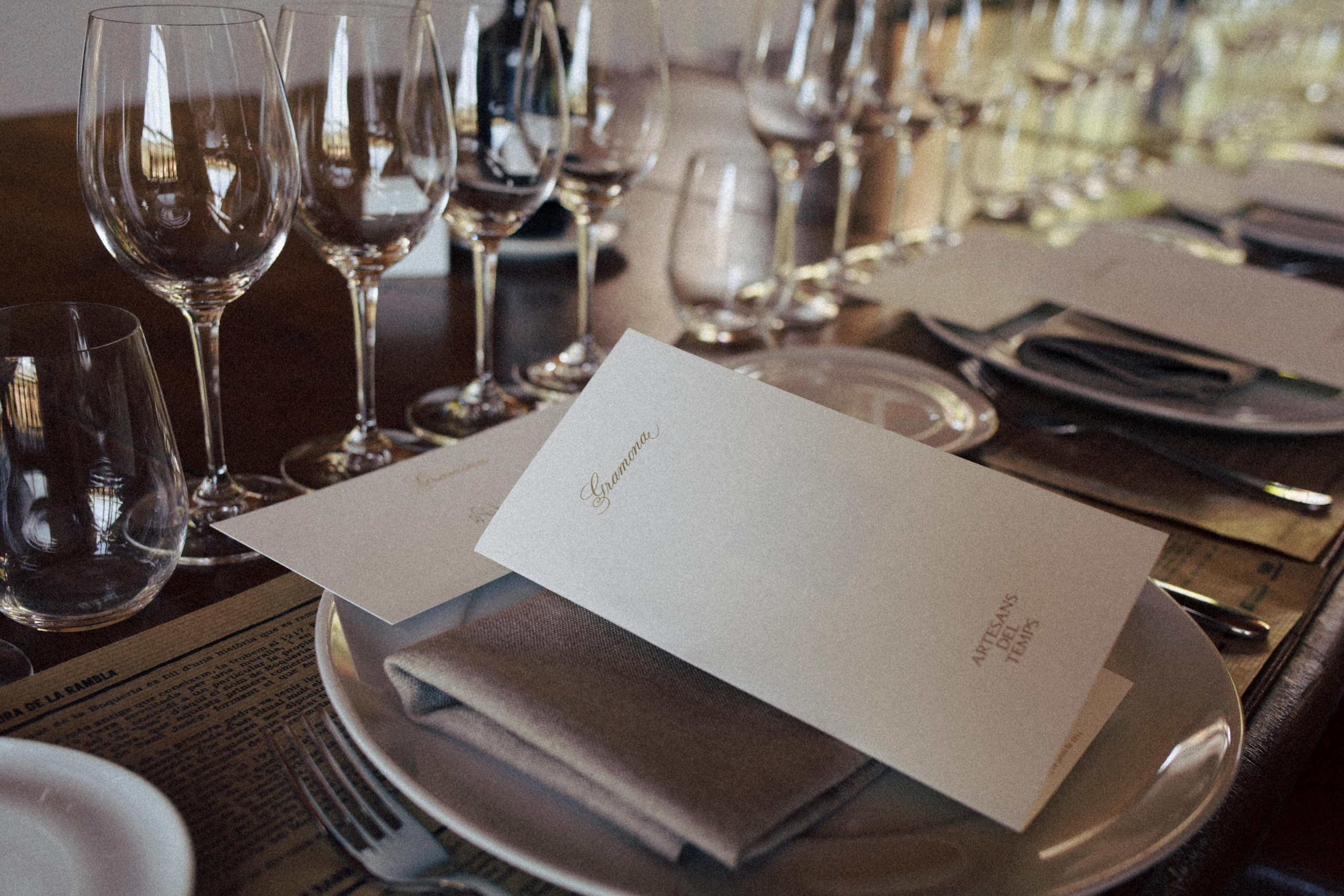 Close-up of long wooden table set for a special wine tasting dinner at Gramona
