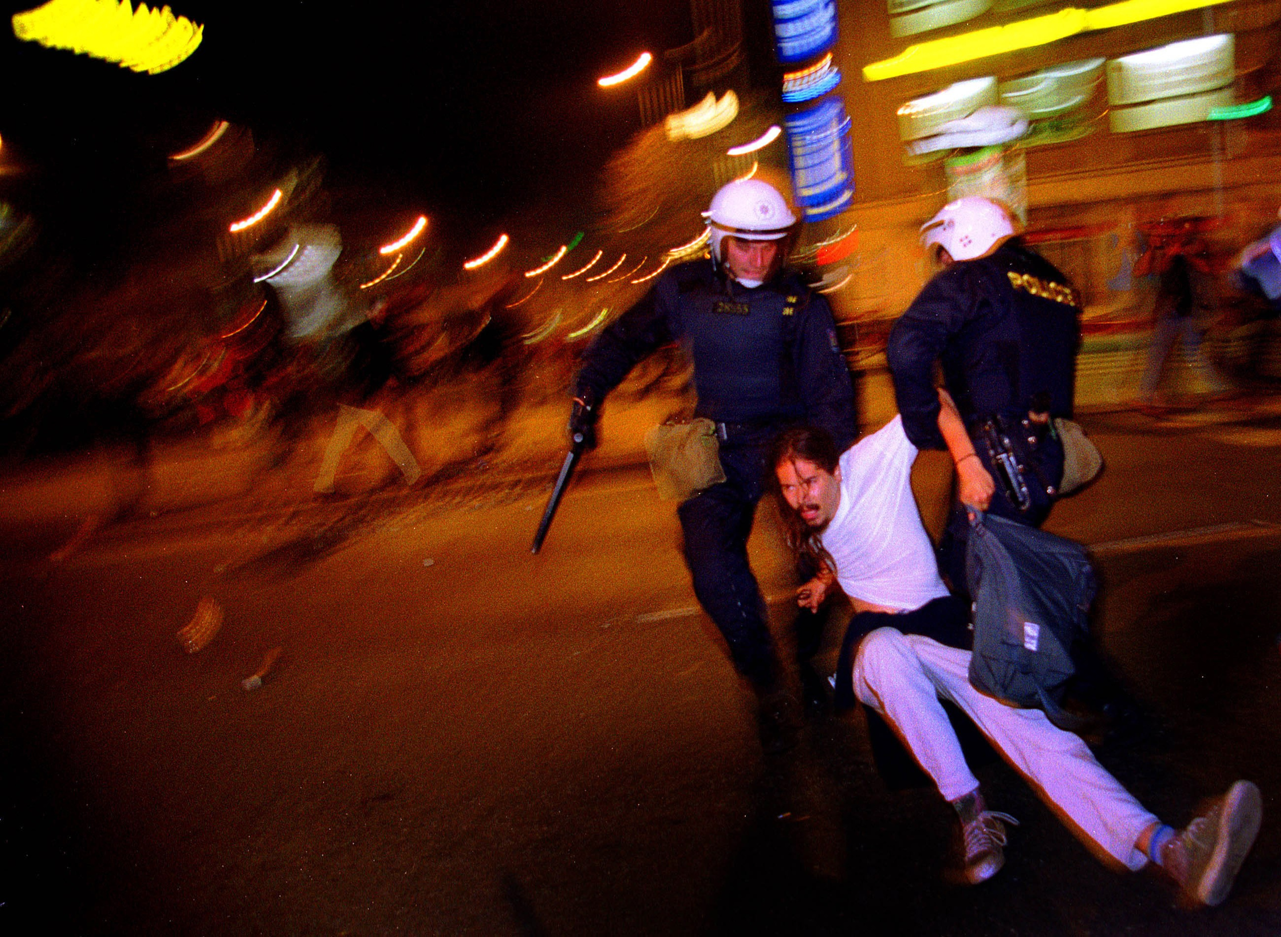 An anti IMF/World Bank protestor is dragged by Czech riot police in the nation's capital on September 27, 2000 after widespread violence broke out causing the annual meeting to end early amid security concerns. Prague riot police battled protestors late into the night as they struggled to contain the escalating violence.