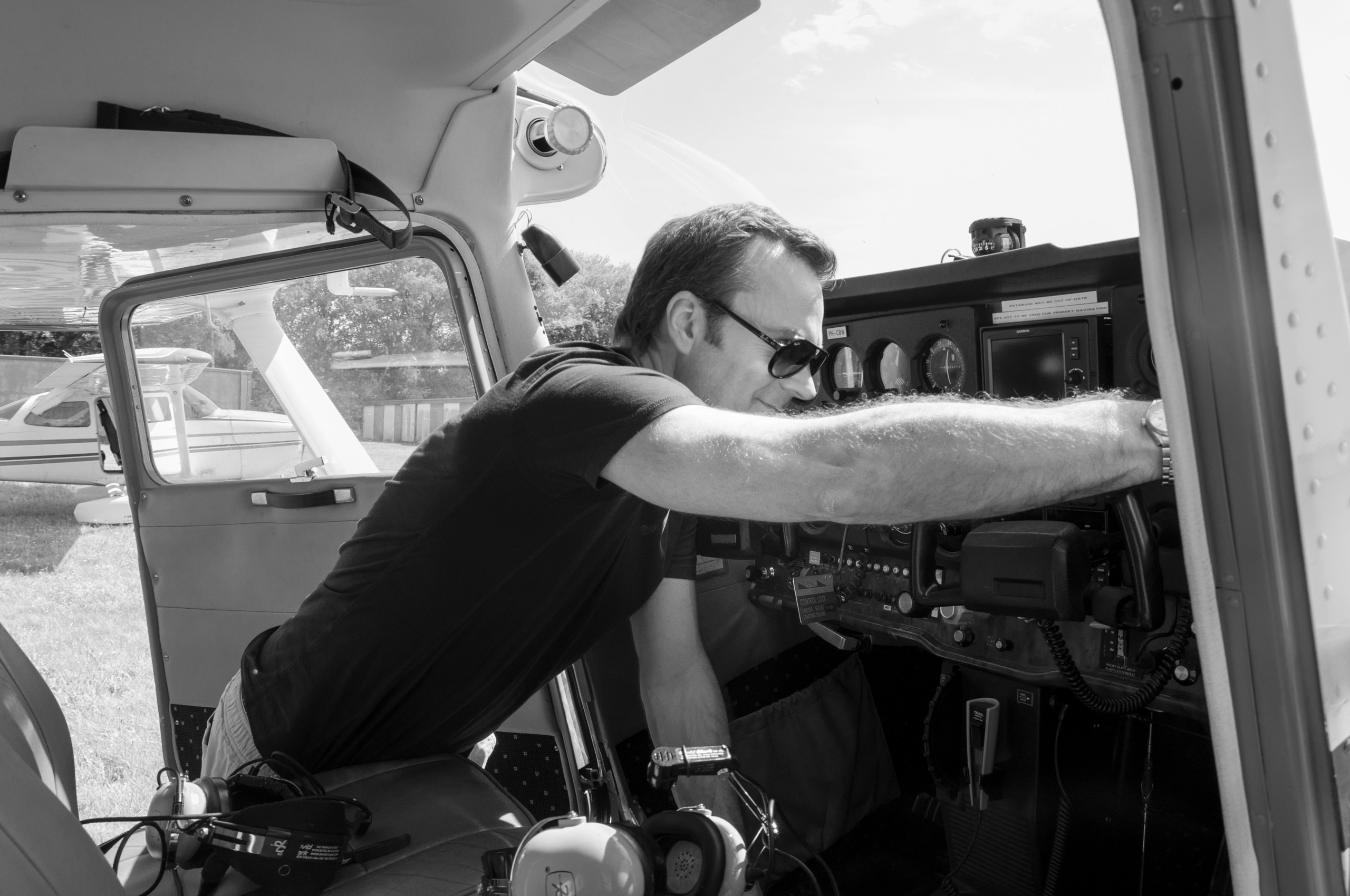 A photoshoot of a pilot and planes. Éclat Photos. Exclusive portrait photography service