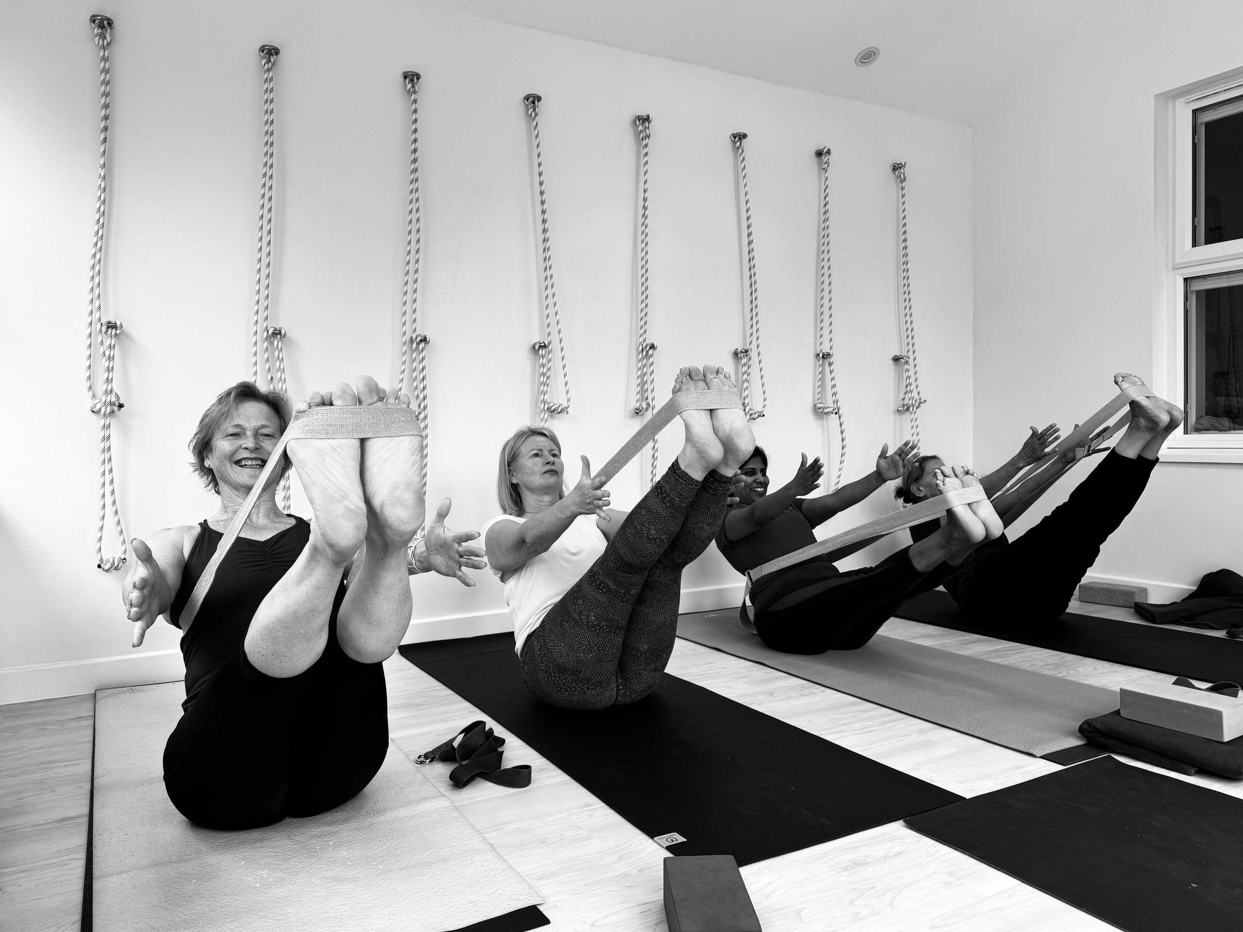 Small Iyengar yoga class in Solihull, students practicing asanas with focus and guidance.
