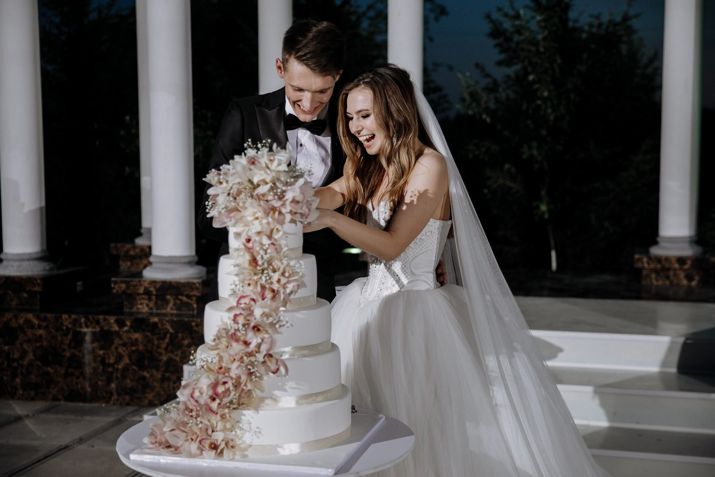 Couple’s cake cut, by Tanya Bodgan, Bude wedding photography.