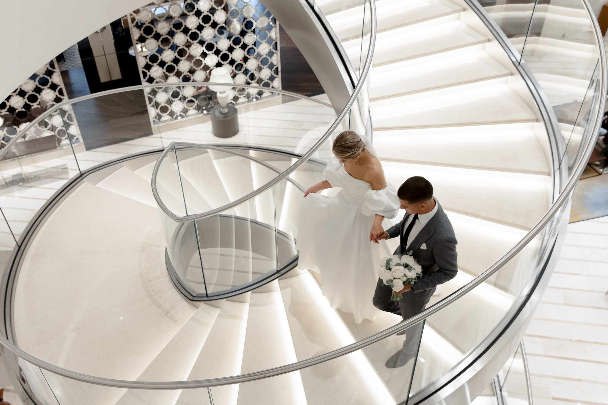 First look staircase walk, by Bude reportage wedding photographer.