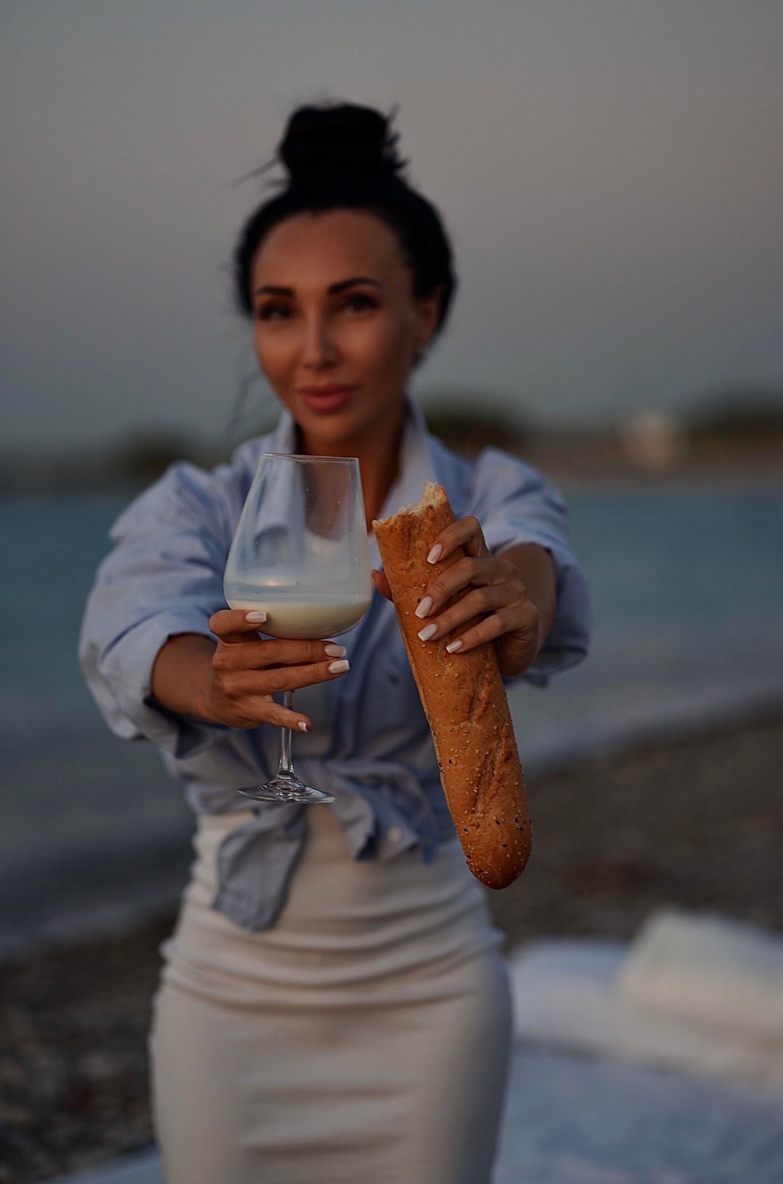 Sunset with beautiful Zenia. Photographer at Santorini