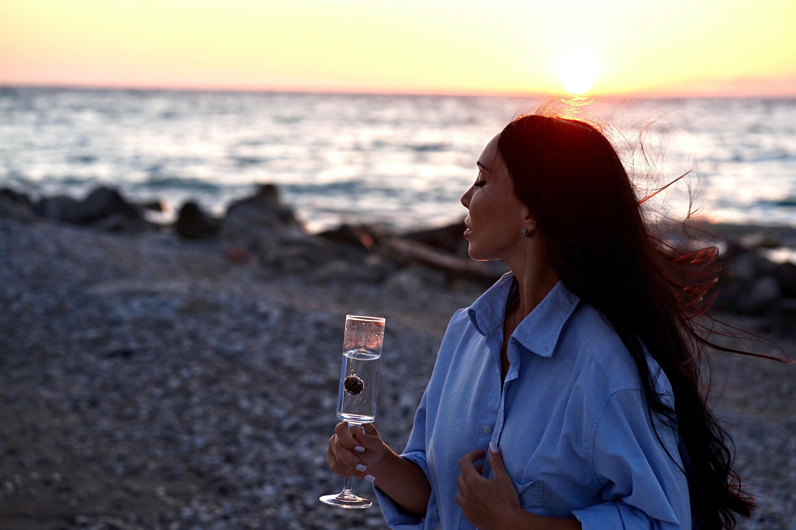 Sunset with beautiful Zenia. Photographer at Santorini
