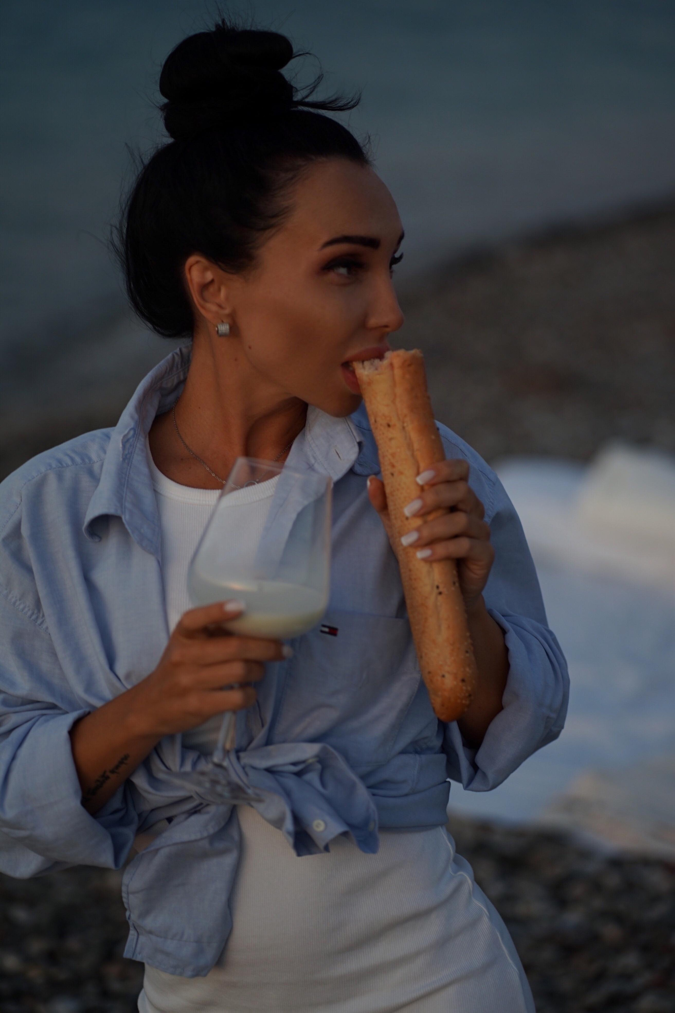 Sunset with beautiful Zenia. Photographer at Santorini