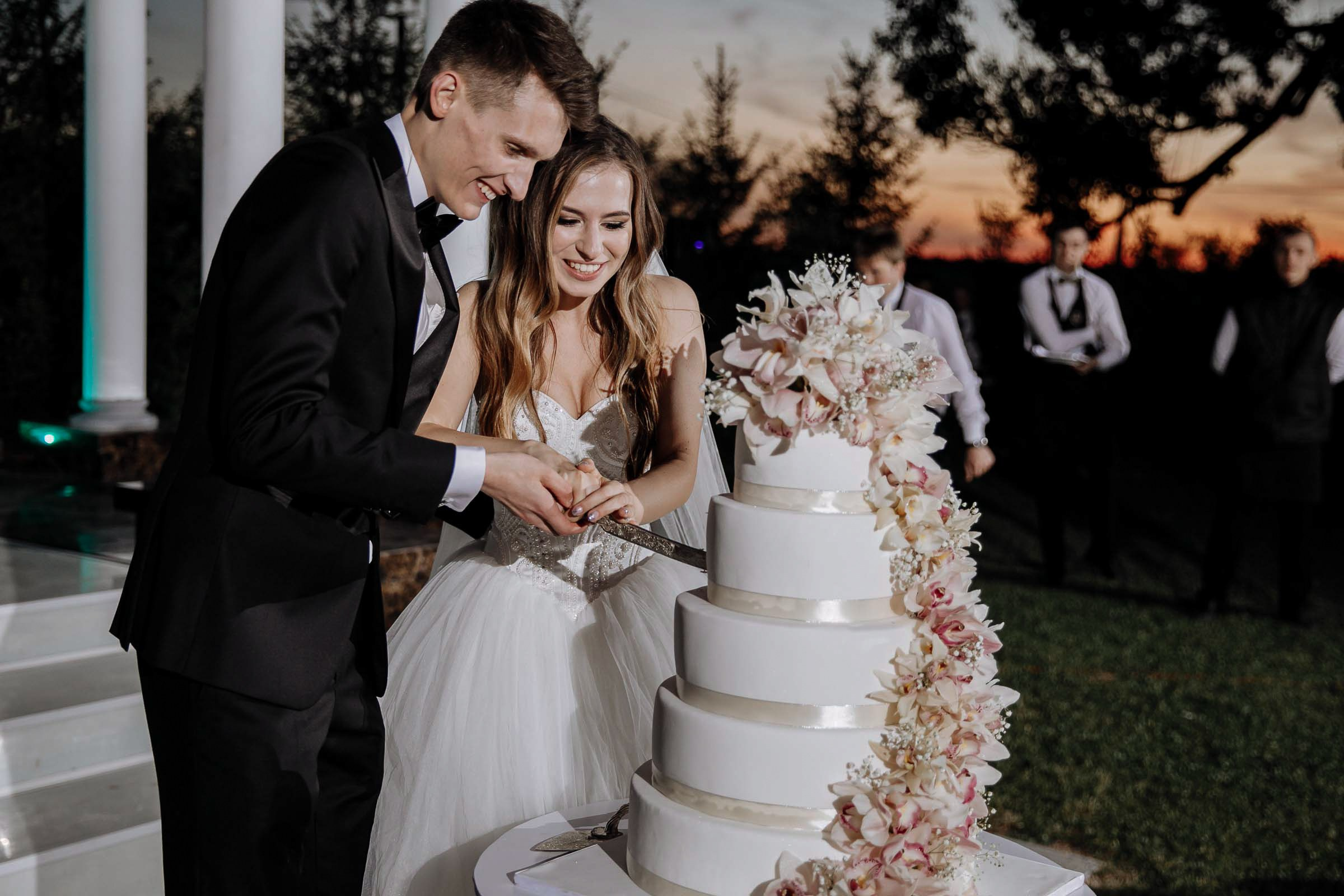 Couple’s cake cut, by Tanya Bodgan, Bude wedding photography.