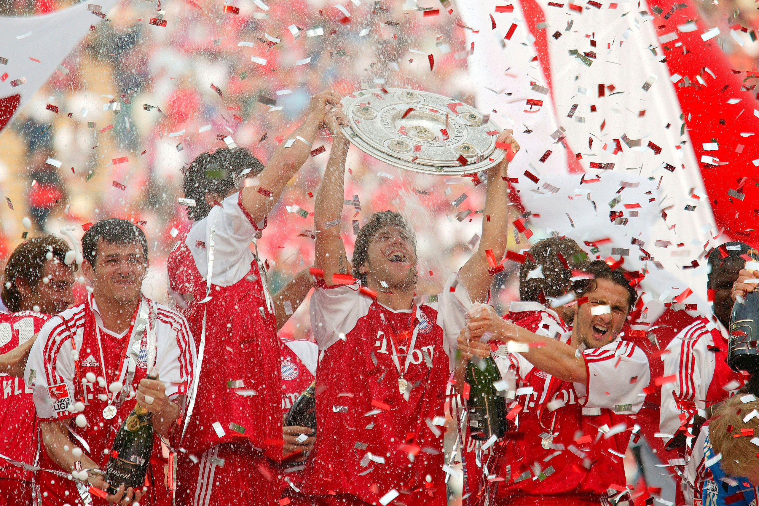 The FC Bayern Munich team celebrate with the trophy after the 1. Bundesliga match between FC Bayern Munich and 1.FC Nuremberg at the Olympic Stadium on May 14, 2005 in Munich, Germany.