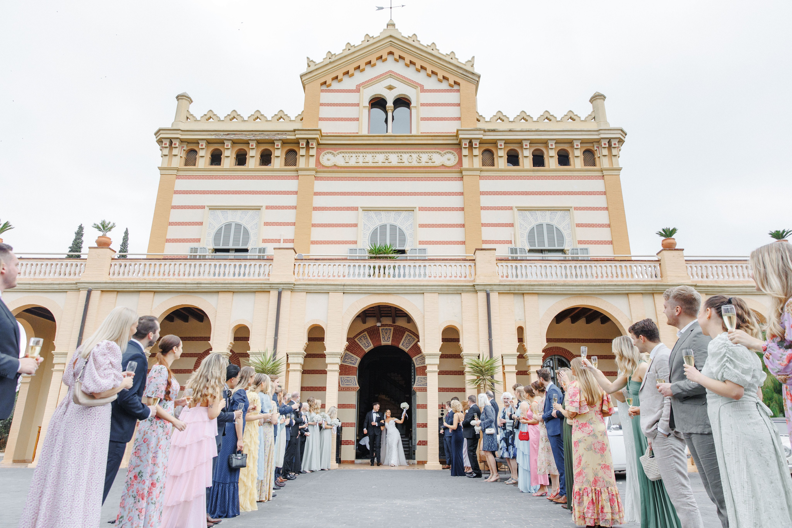 Group photo of friends gathered together at the wedding reception in Barcelona, capturing memories of the celebration.